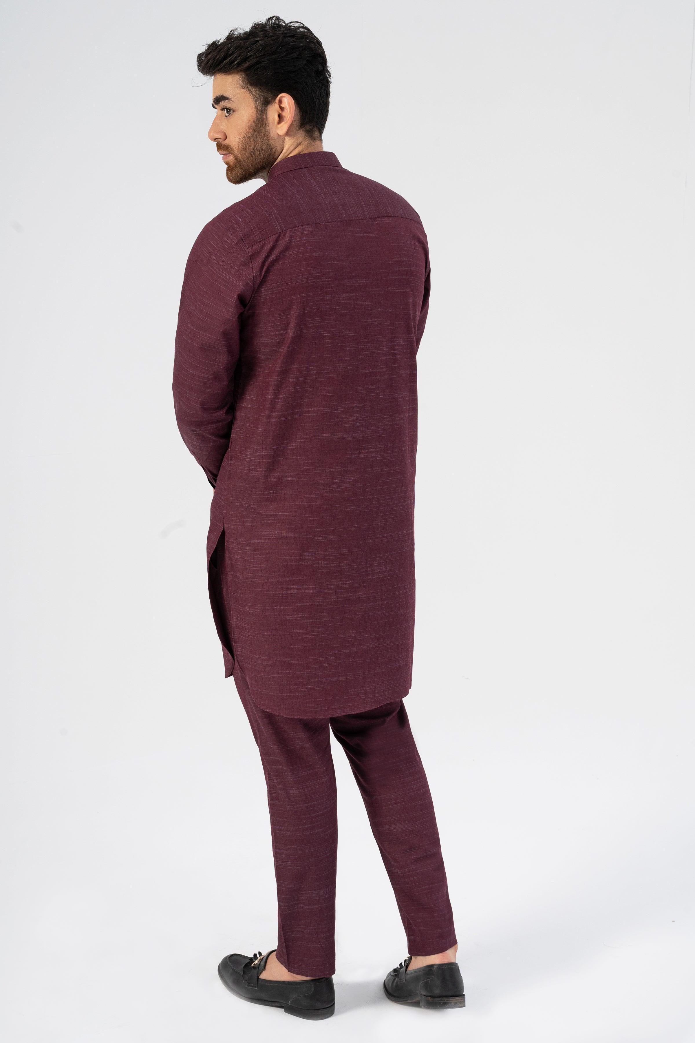 Maroon textured long kurta and matching slim pajama pants, side view