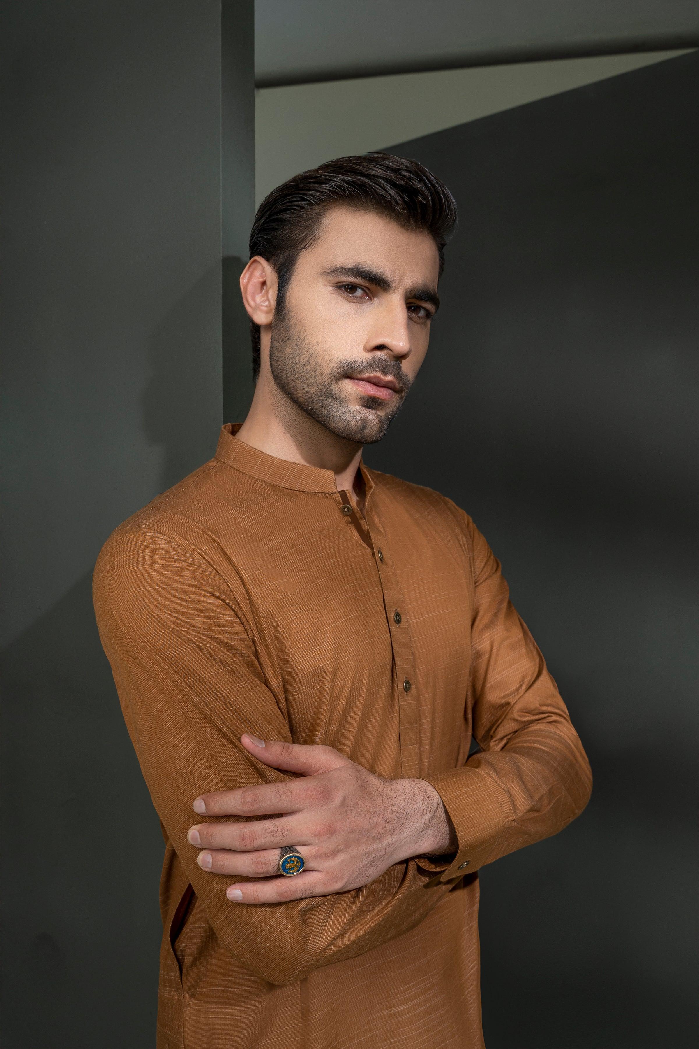 Mustard textured kurta with long sleeves and chest buttons, standing pose