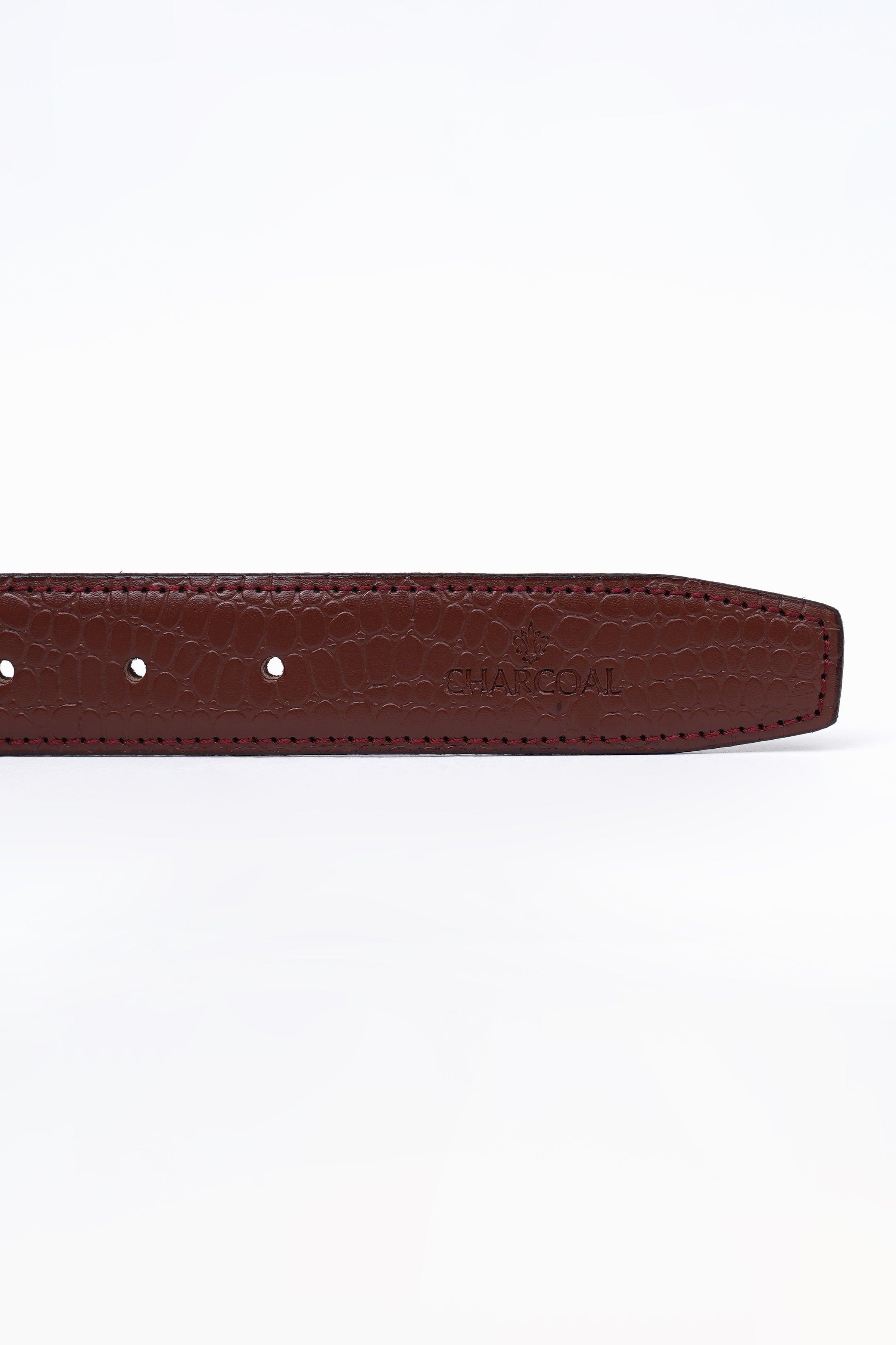 Brown leather belt strap detail with row of holes and stitching