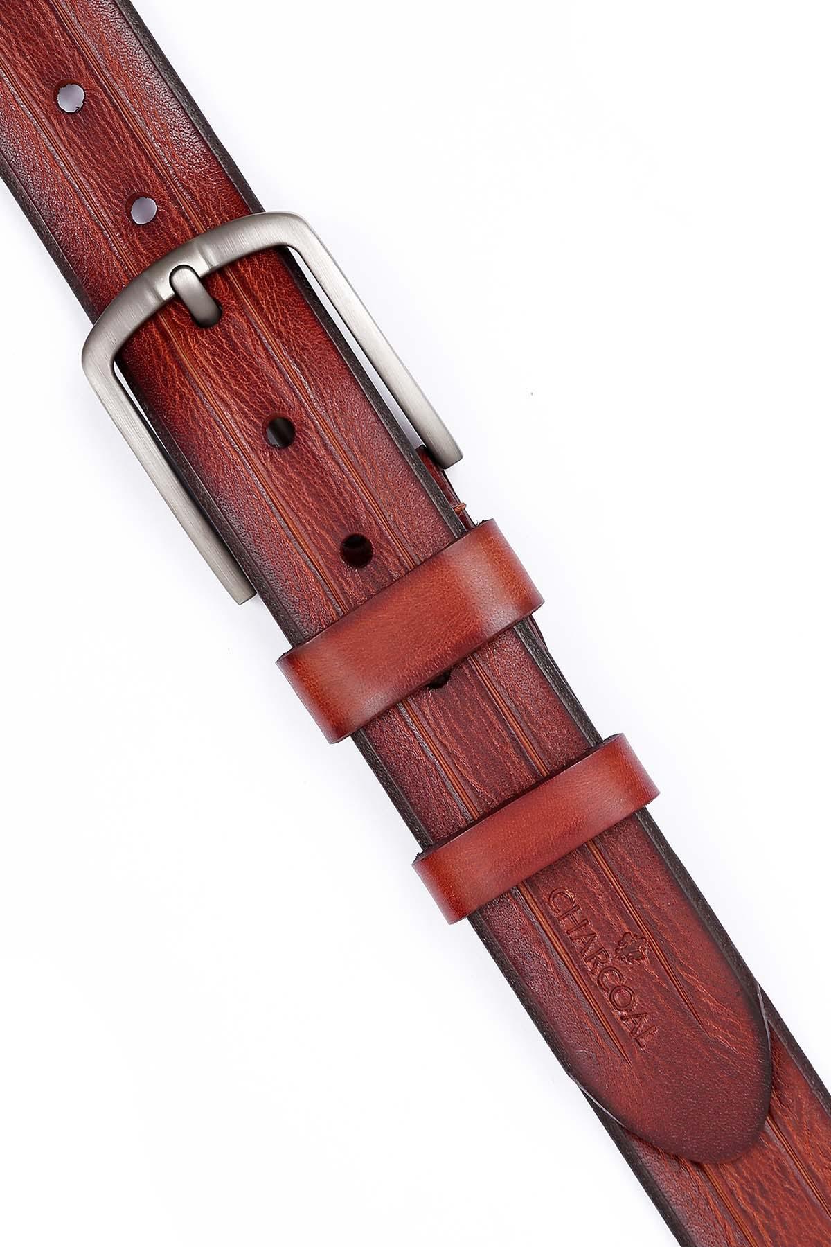 Formal belt close-up: brown leather keeper with silver buckle and punched holes