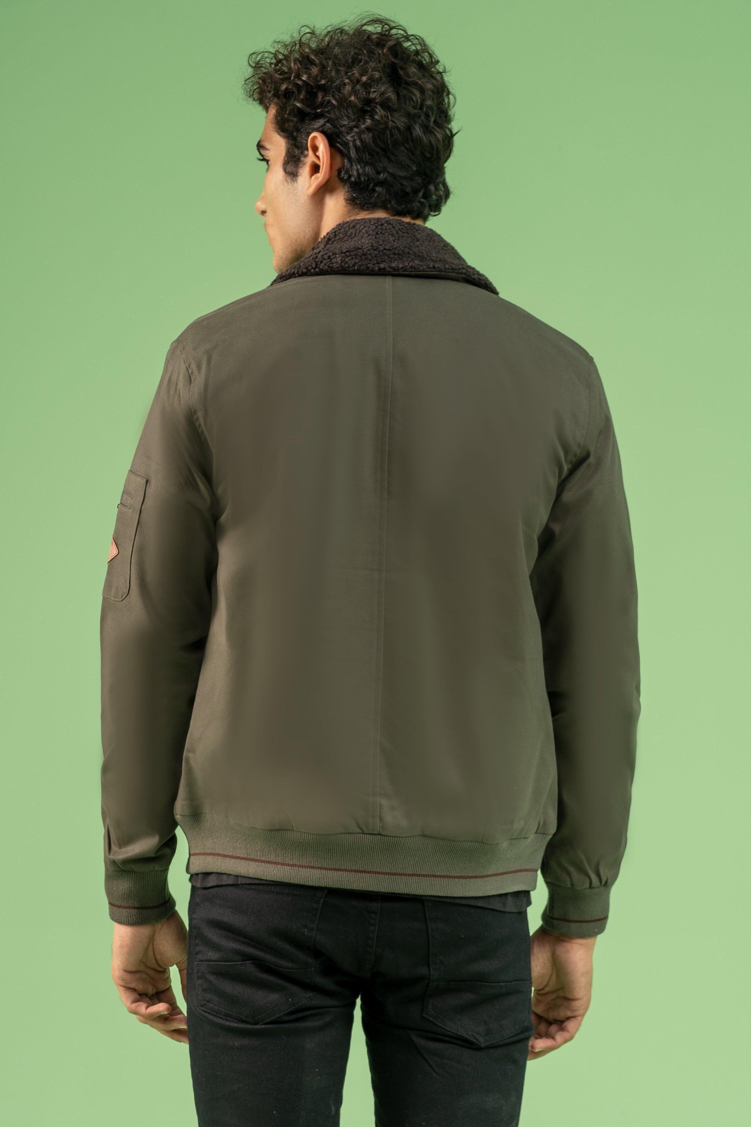 Back view of dark olive cotton jacket with dark fur collar and ribbed cuffs