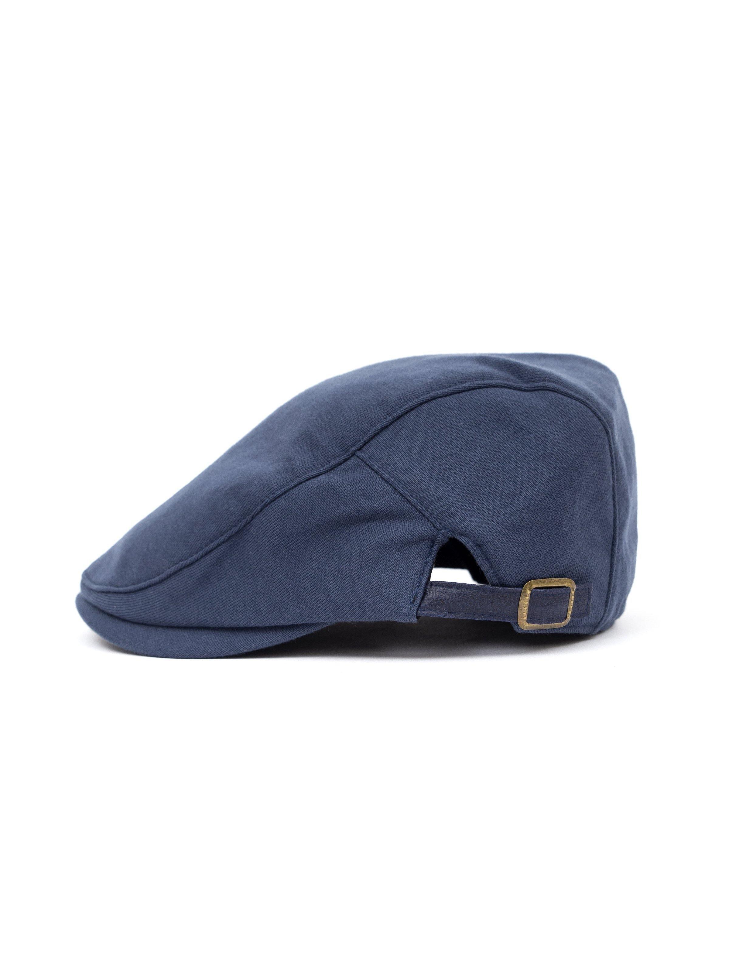 Navy golf cap side view with adjustable strap and brass buckle