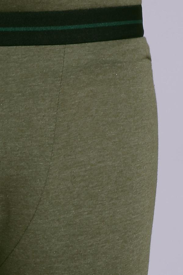 Green warmer lower close-up of waistband and textured knit fabric