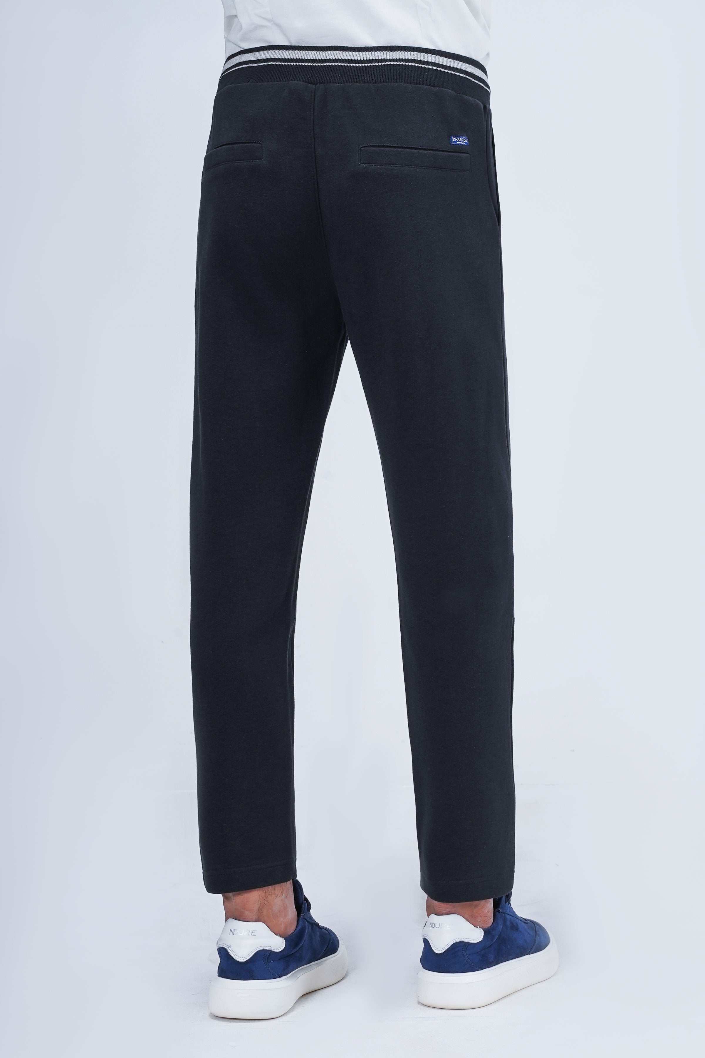 Black slim jogger trousers, back view with tapered fit and ankle-length hem