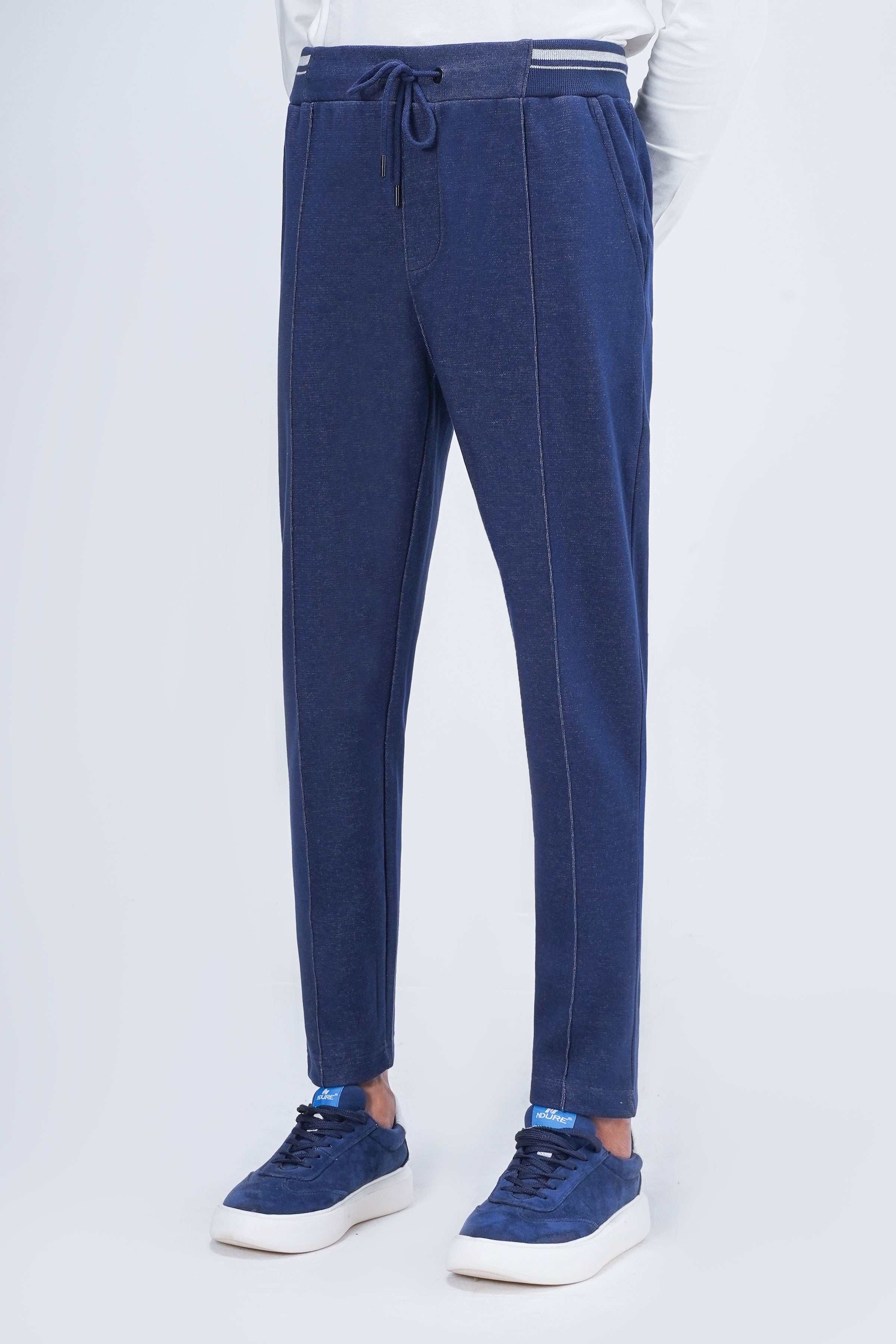 Indigo slim jogger trousers with tapered legs, drawstring waist and side pockets