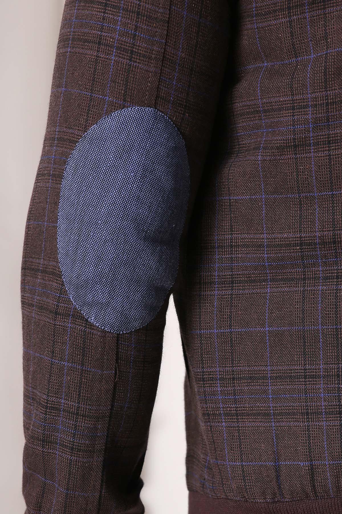Brown check jacket sleeve with blue inner cuff and ribbed hem