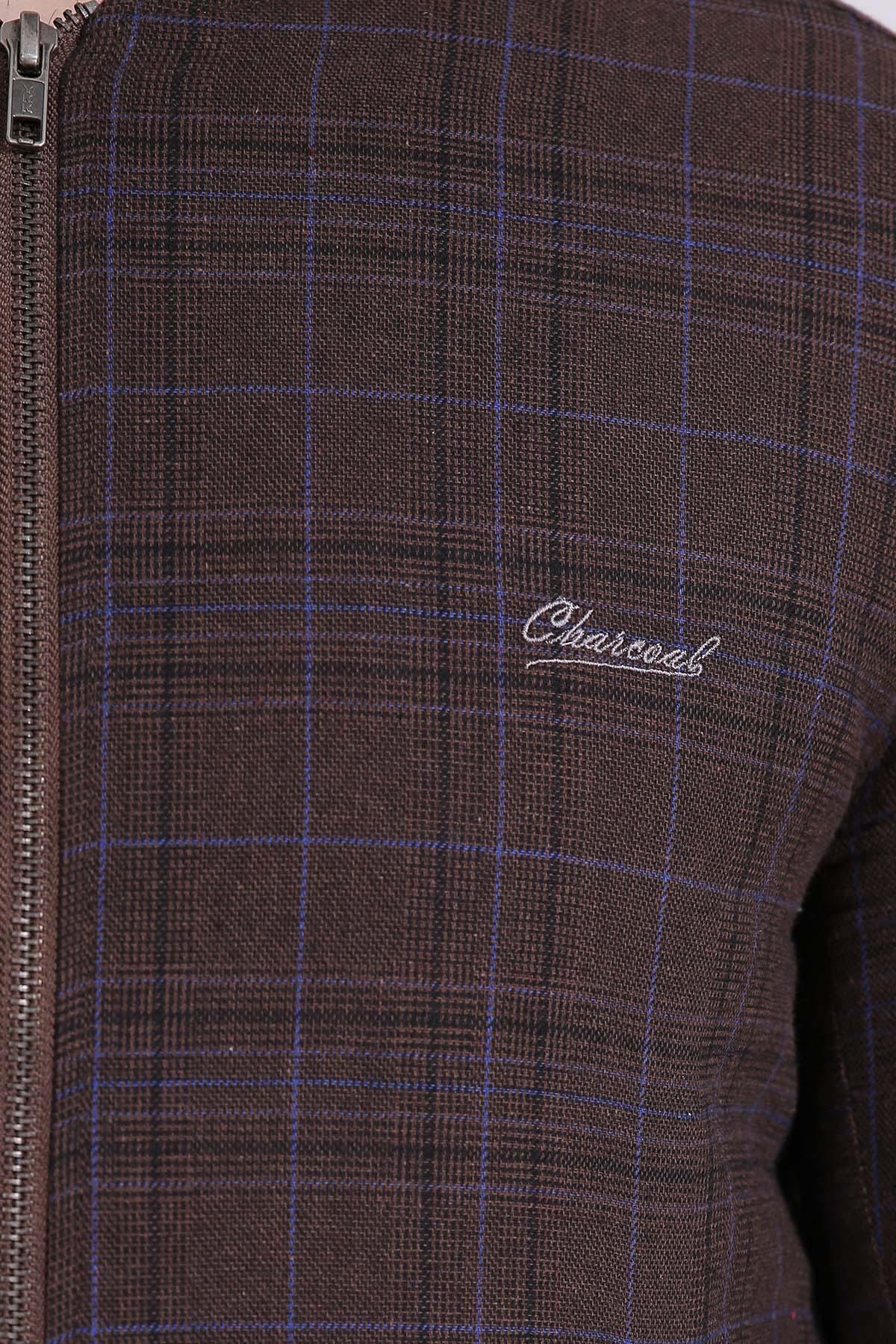 Brown check jacket fabric close-up with blue grid lines and chest logo