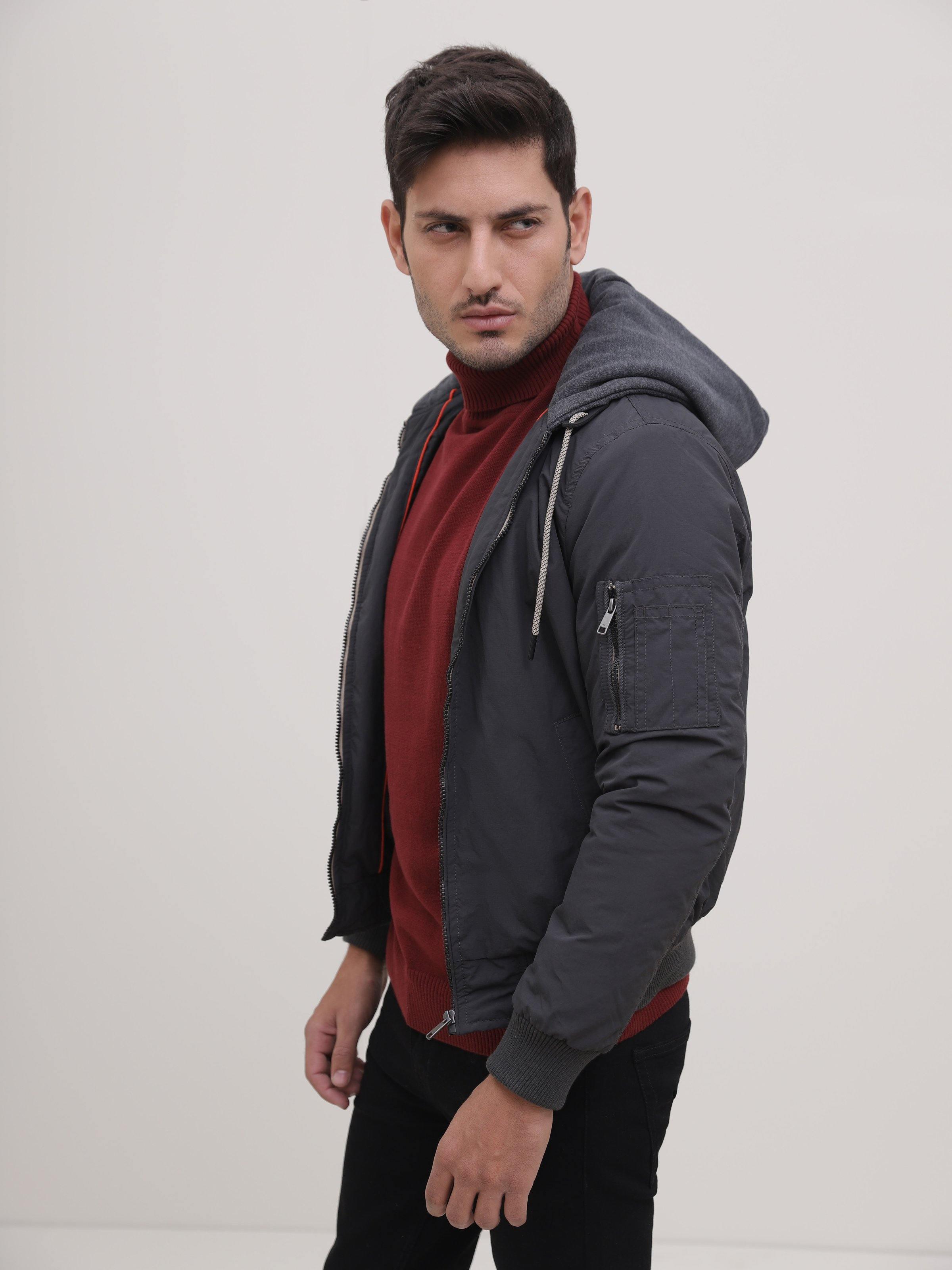 Dark grey zip jacket with hood, side profile view, long sleeves