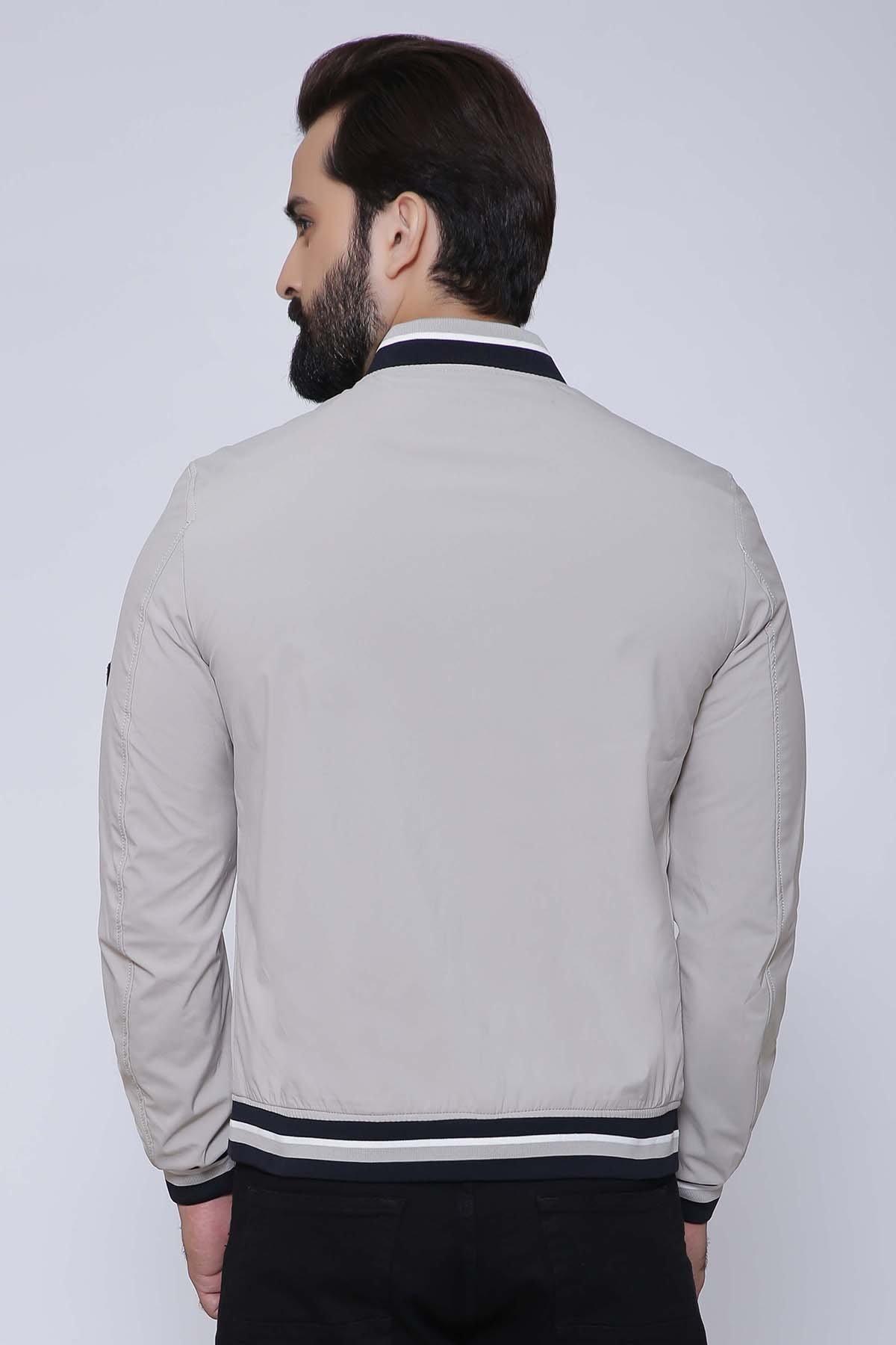 Light beige full-sleeve jacket, back view, with striped ribbed cuffs and hem.