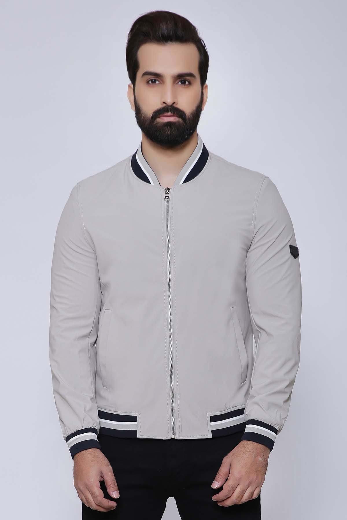 Light beige full-sleeve zip jacket with striped ribbed collar, cuffs, and hem.
