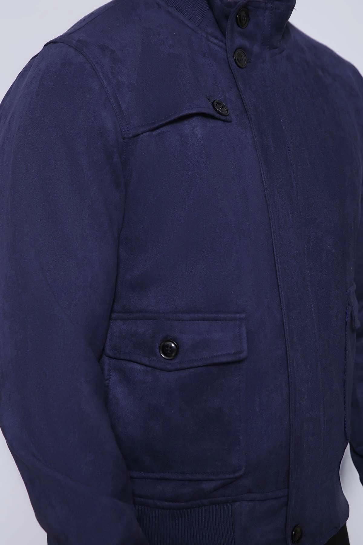 Navy jacket close-up of stand collar, button placket, and flap chest pocket