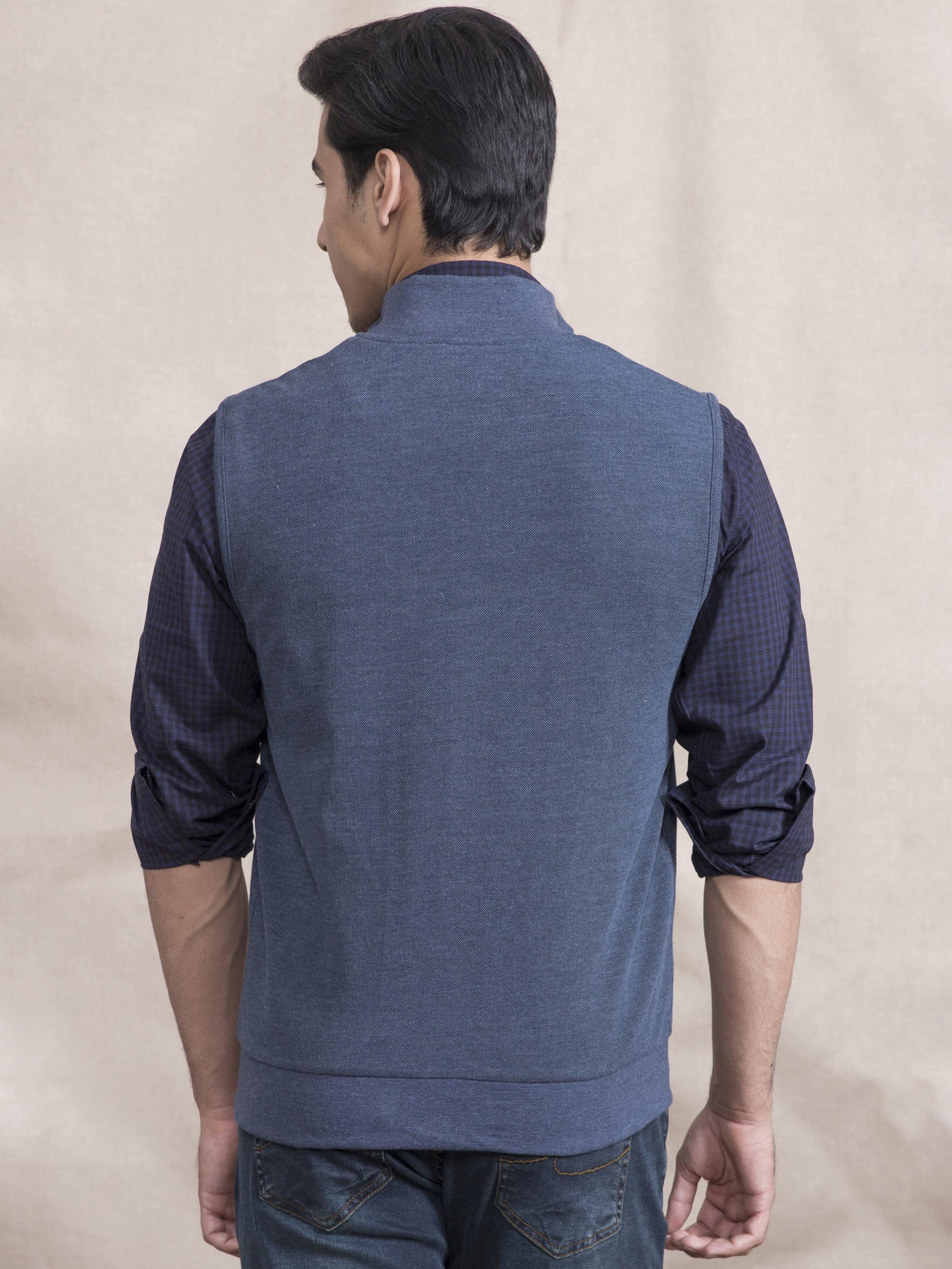 Back view of blue sleeveless zip jacket with stand collar