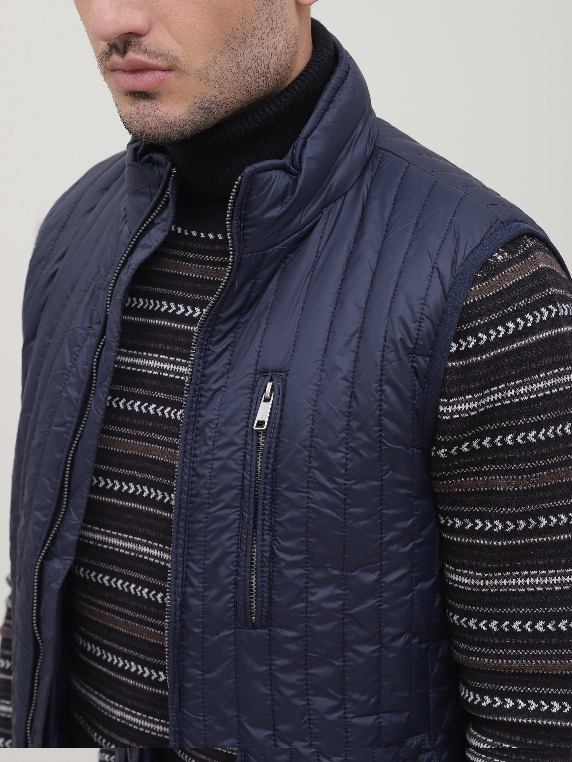 Navy sleeveless jacket front with zipper, stand collar, and quilted stitching