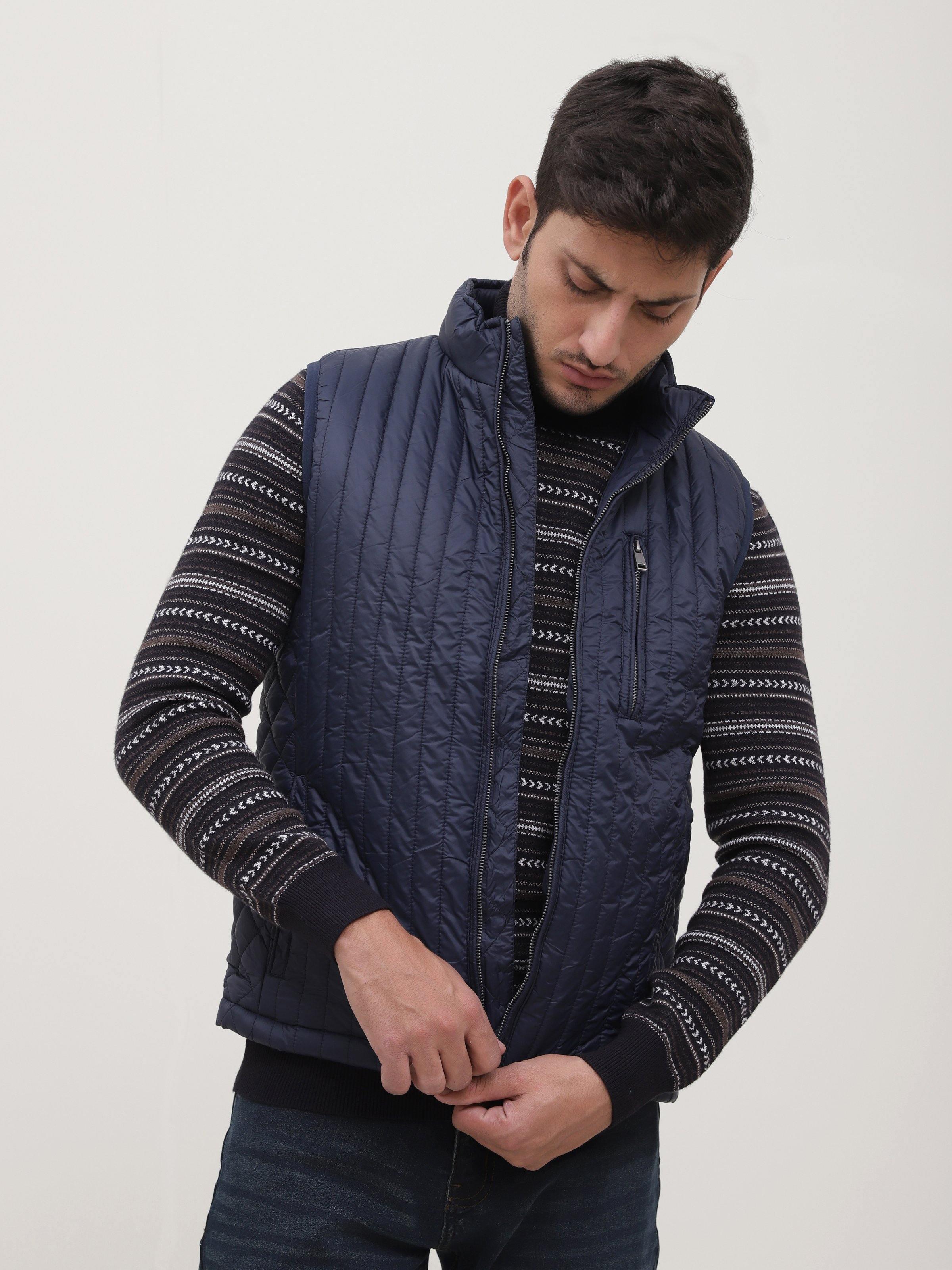 Men's navy sleeveless quilted jacket with front zipper and stand collar