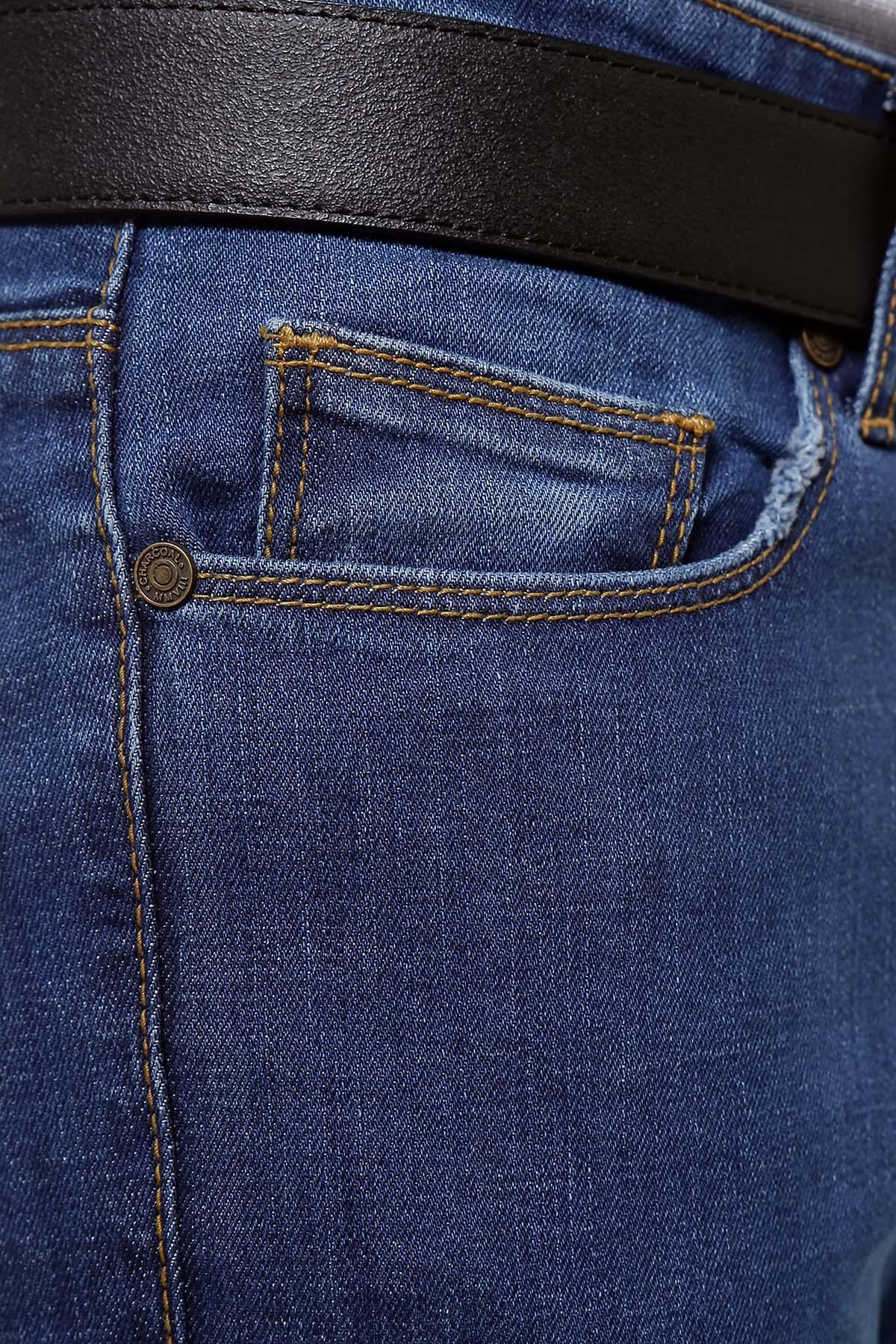 Light blue denim front pocket close-up with stitched coin pocket and button