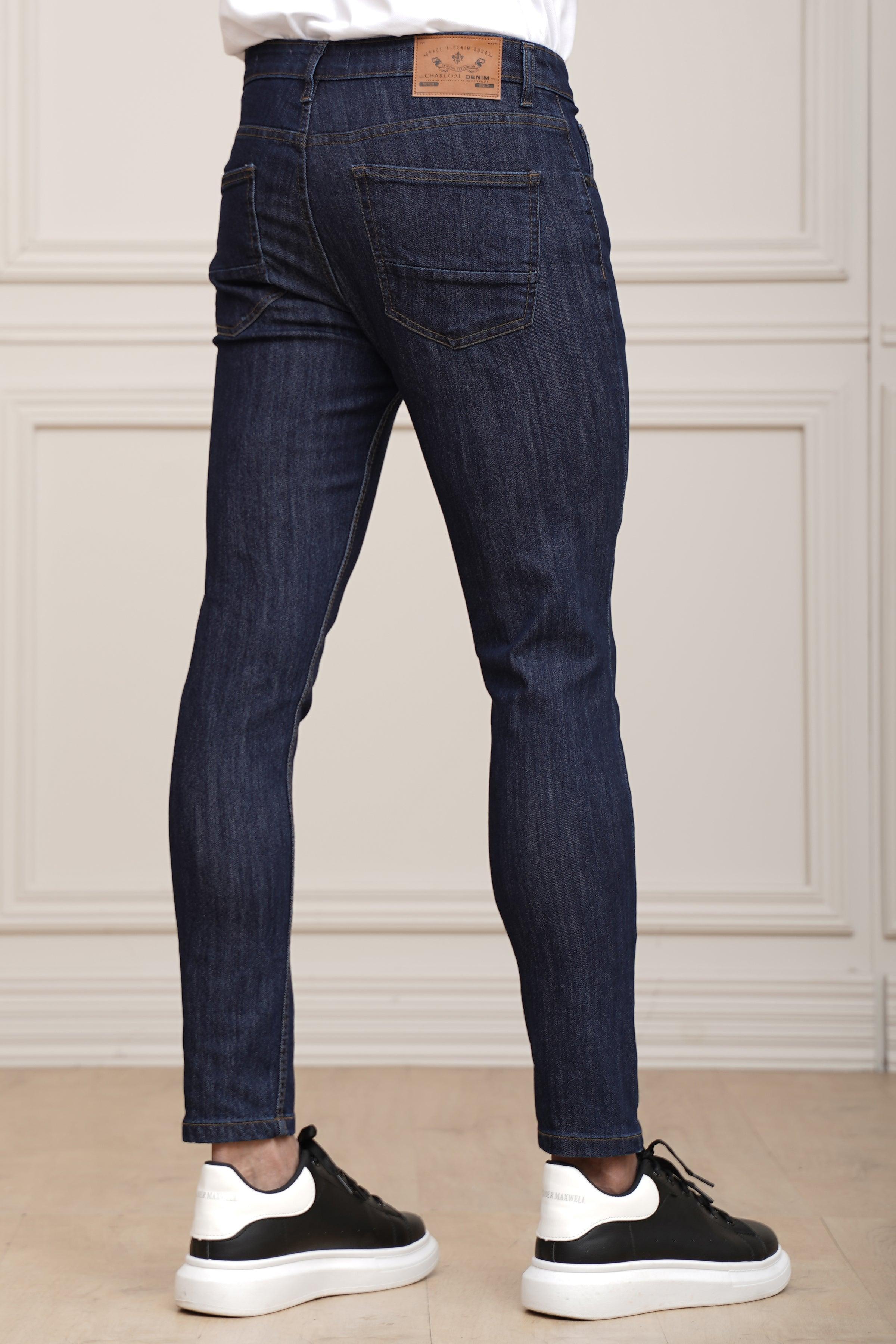 Navy blue slim jeans front view: five pockets, belt loops, and button fly