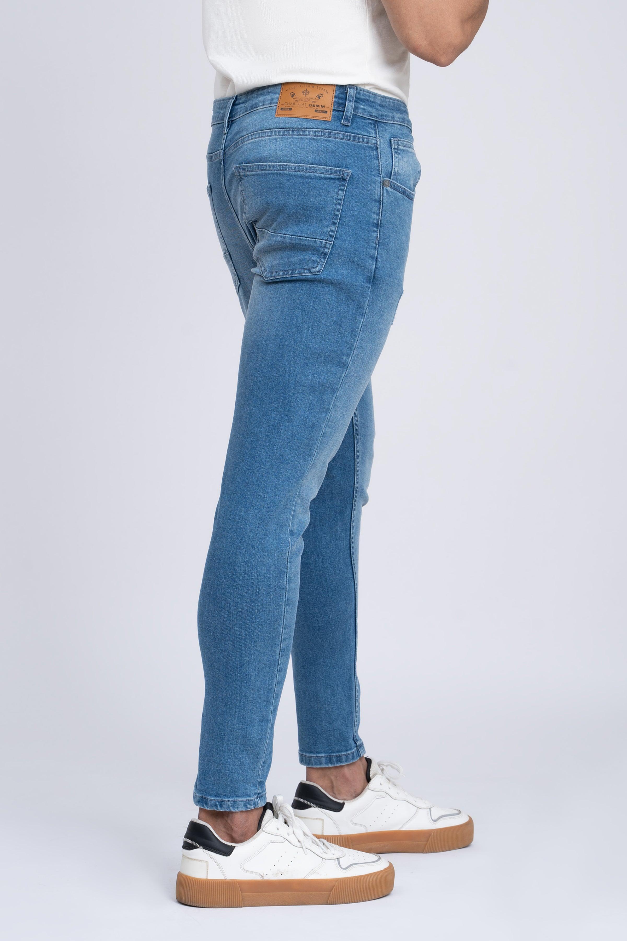 Light blue skinny jeans with five-pocket design and slim ankle-length leg