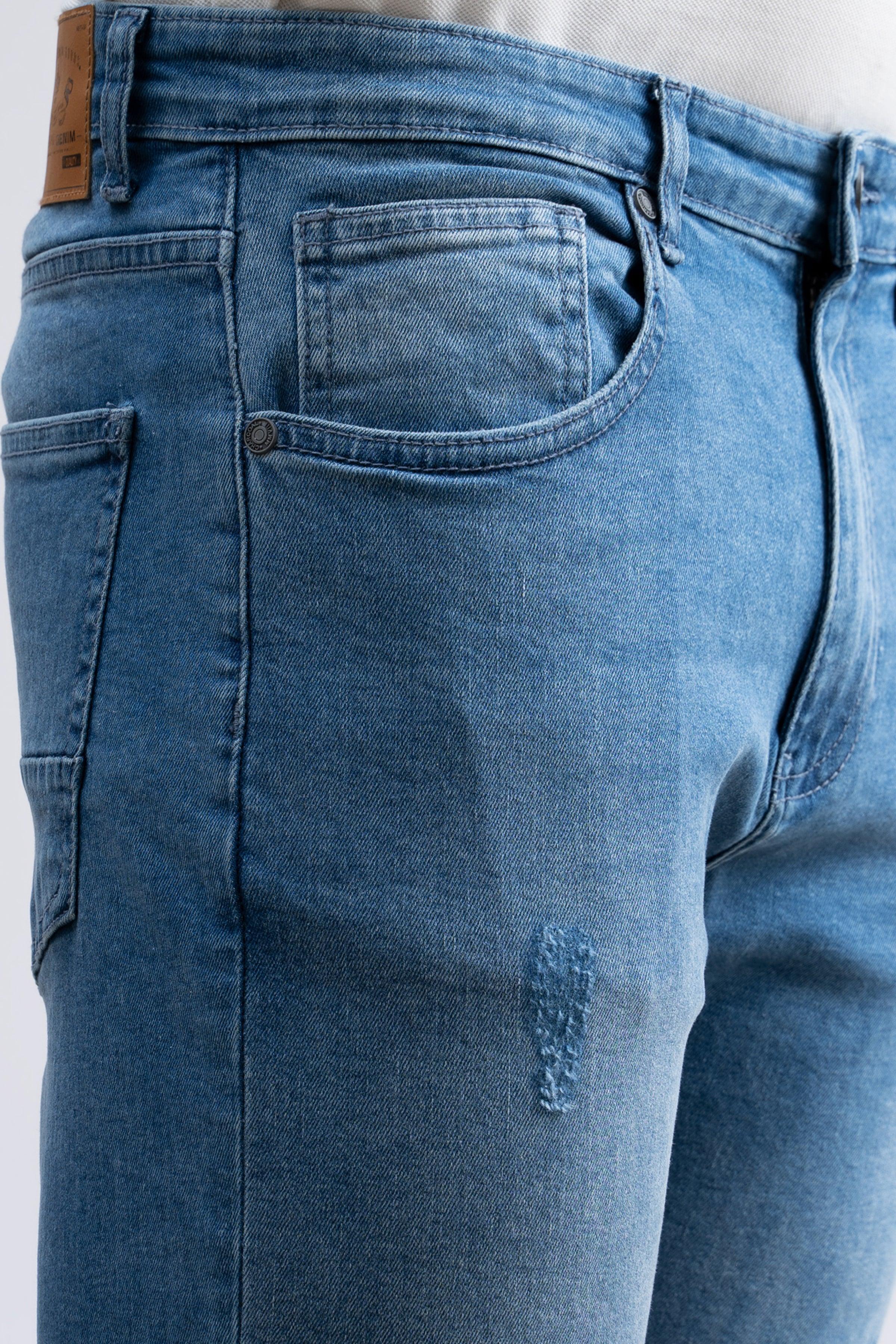 Light blue skinny jeans close-up of front pocket, fly, and waistband
