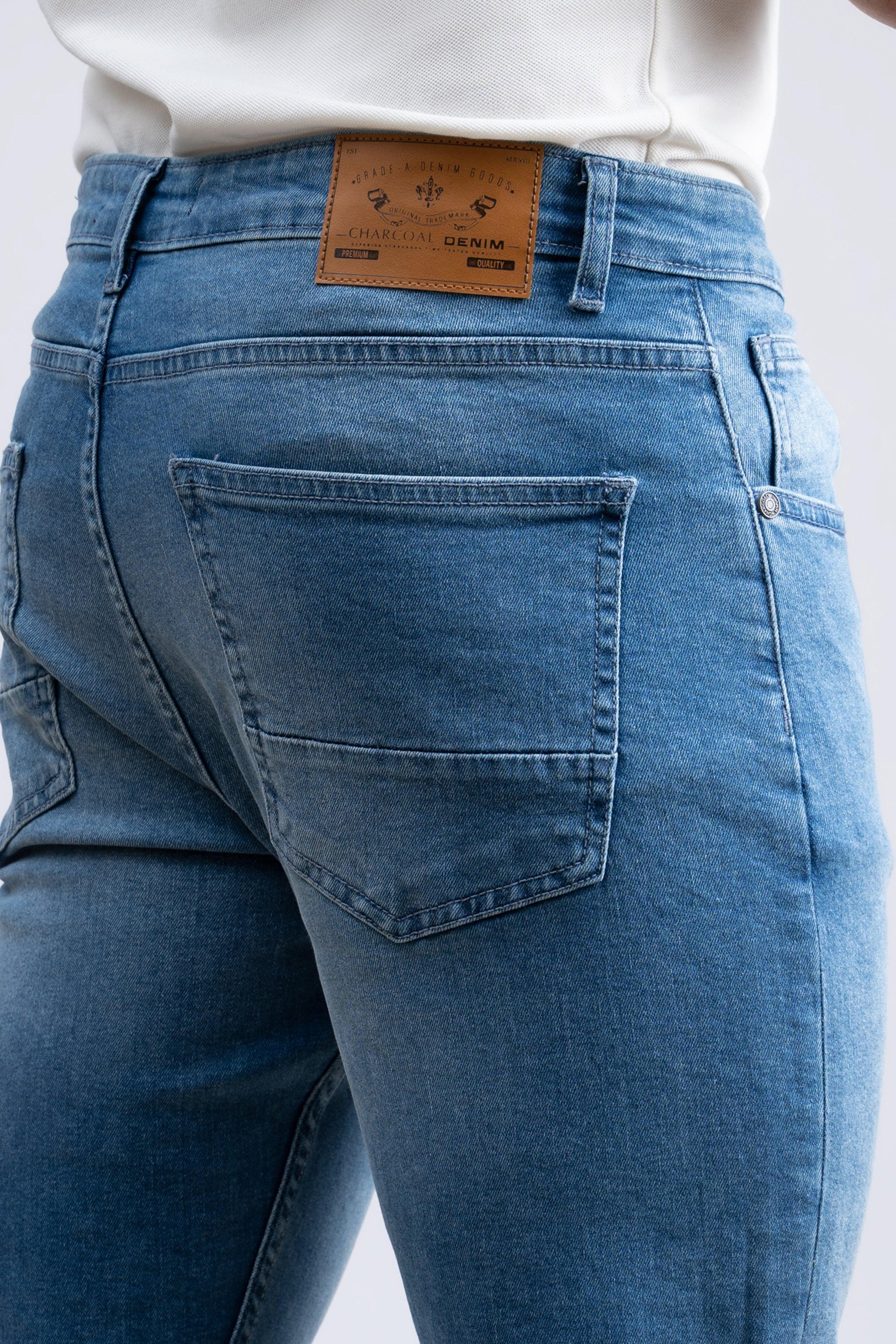 Light blue skinny jeans close-up of back pocket and waistband label