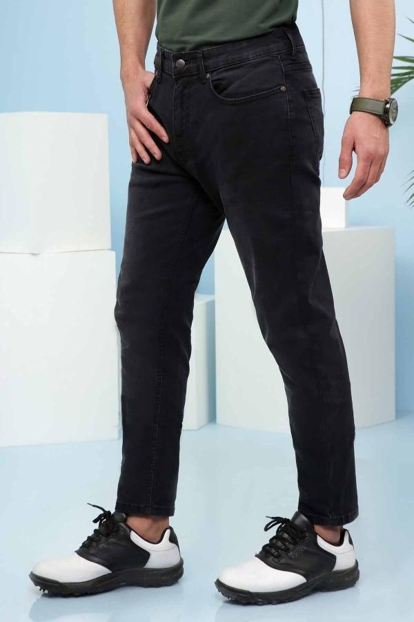 Dark slim-fit jeans with front coin pocket and tapered leg