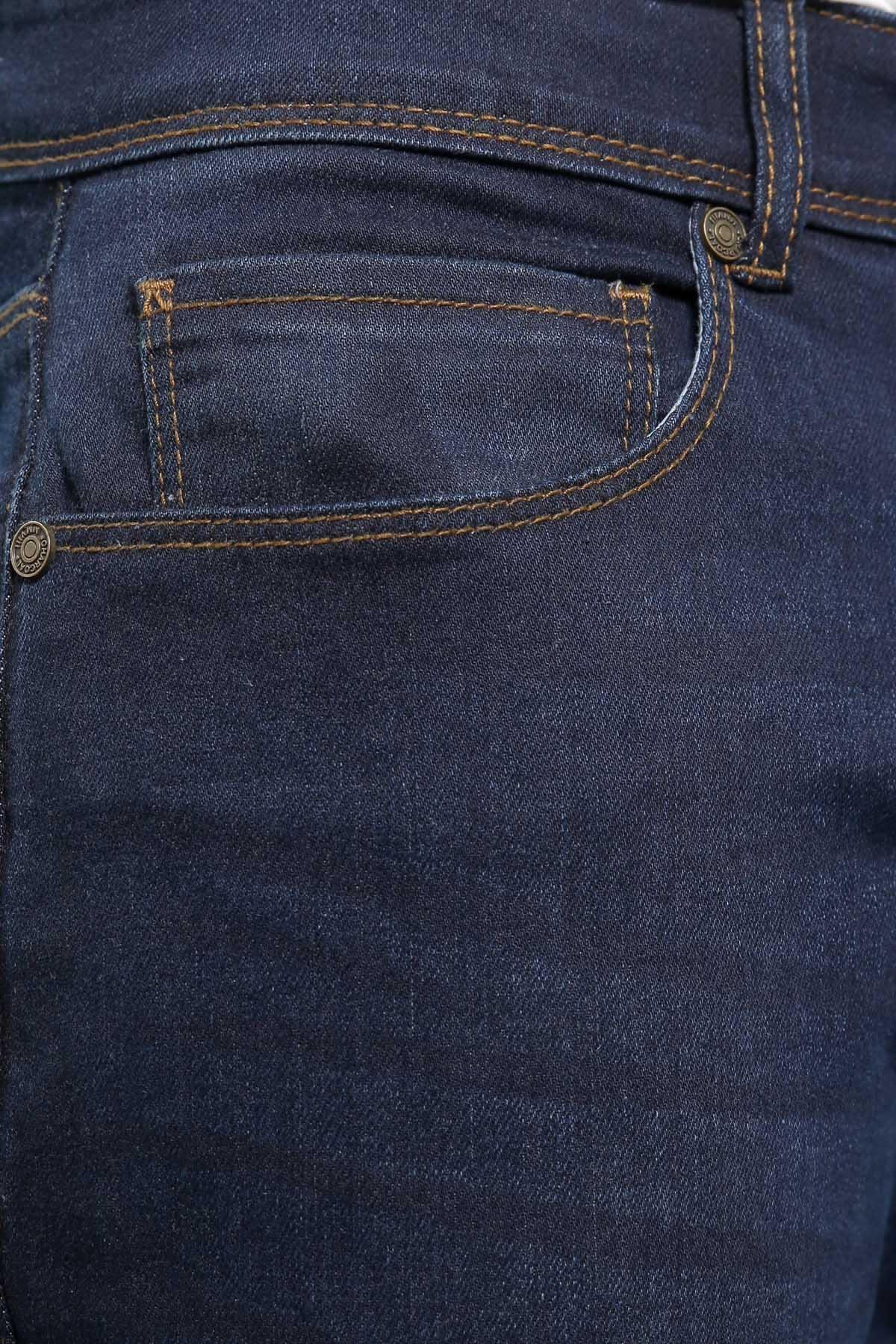 Mid navy denim jeans front pocket close-up with contrast stitching