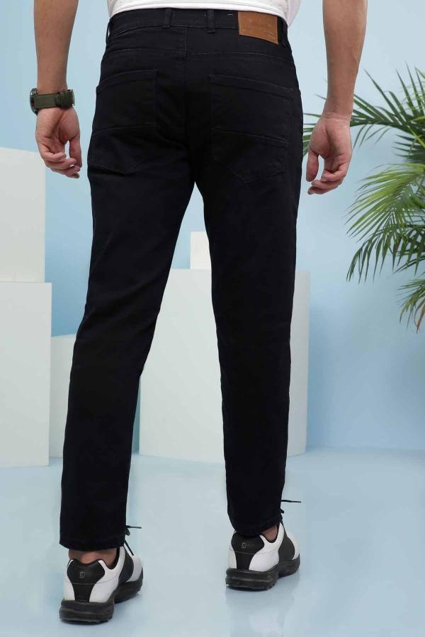 Slim-fit navy jeans shown from back with belt loops and dark wash