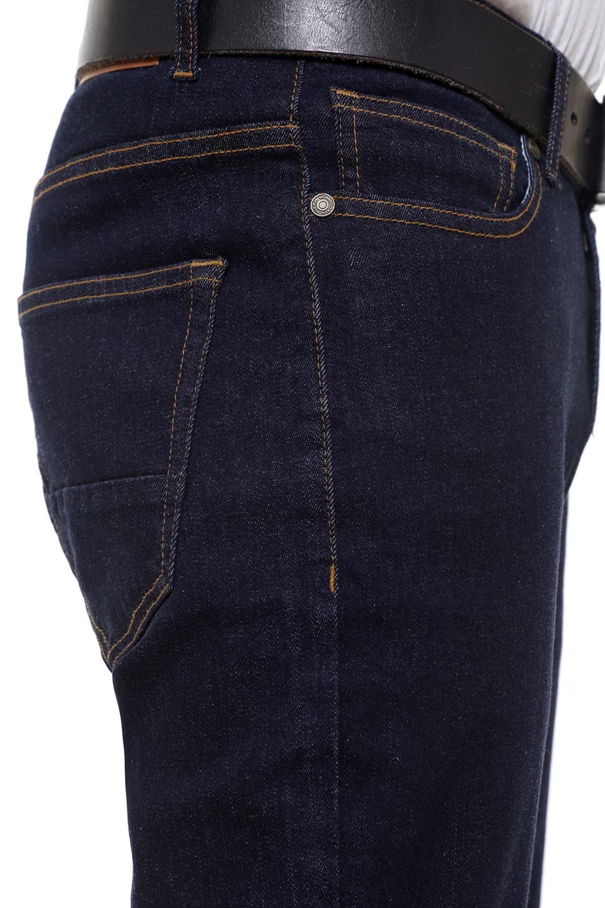Navy denim jeans close-up with belt loops, button closure, and stitched front panel