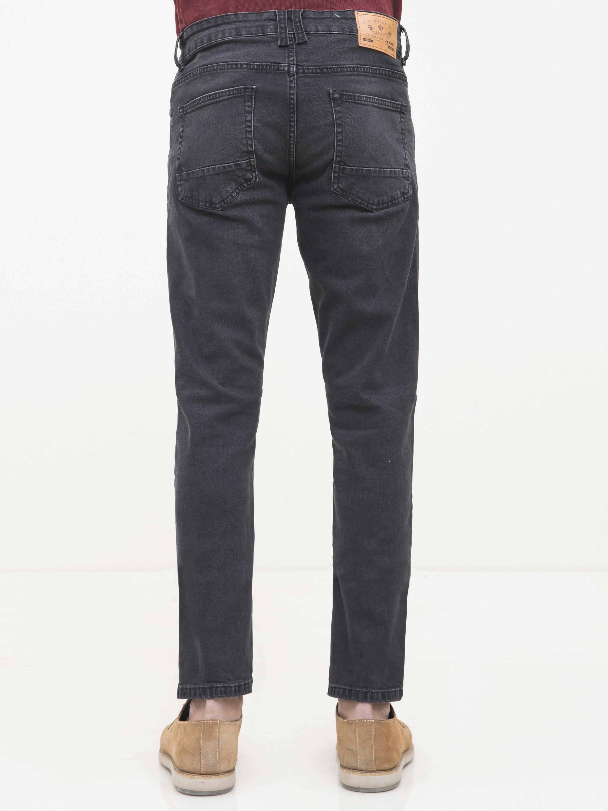Dark grey slim-fit jeans, back view with stitched pockets and belt loops.