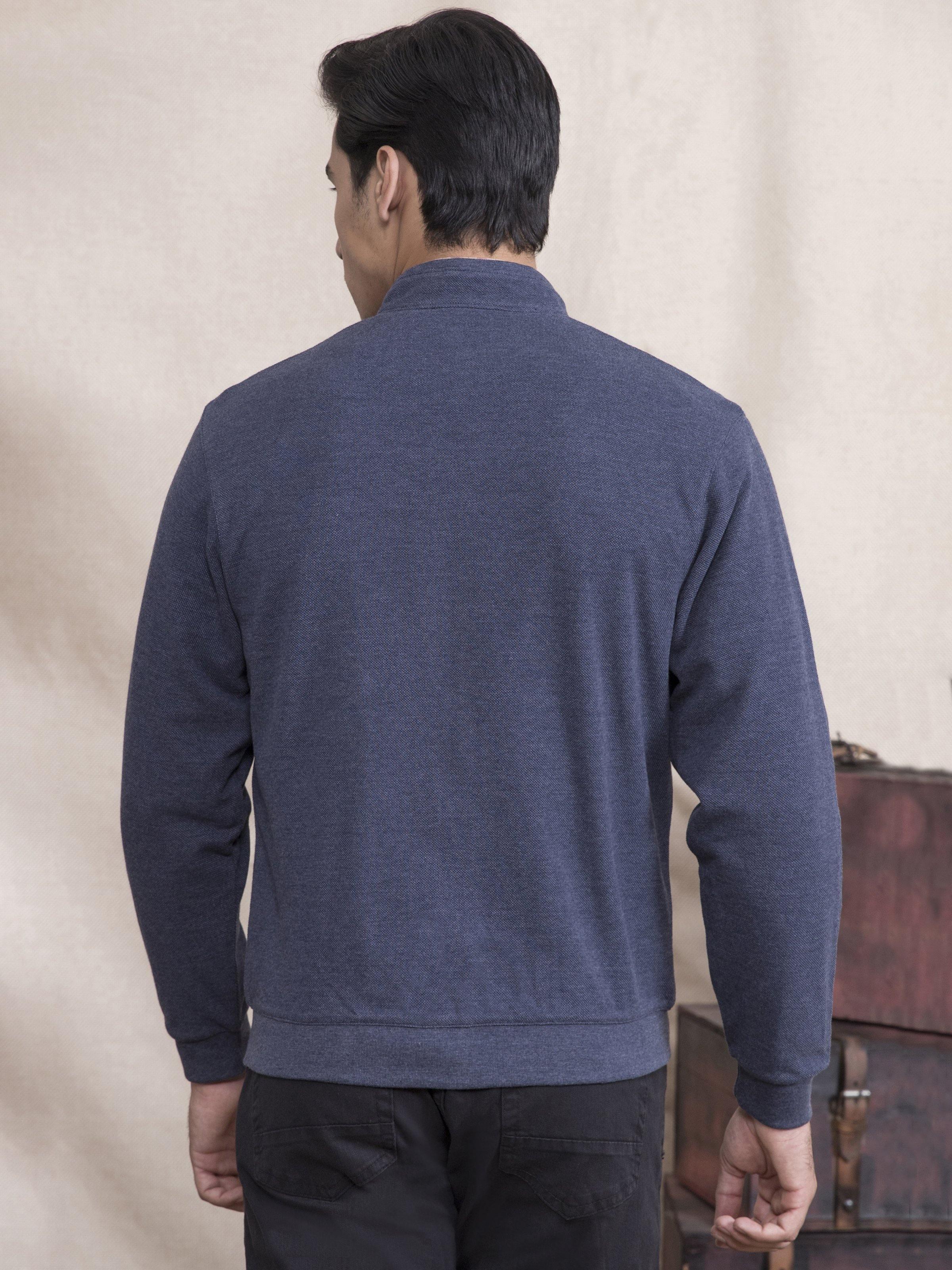 Navy blue knit zip jacket, back view with full sleeves and ribbed hem