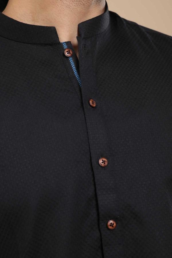 Black band-collar kurta close-up with brown button front