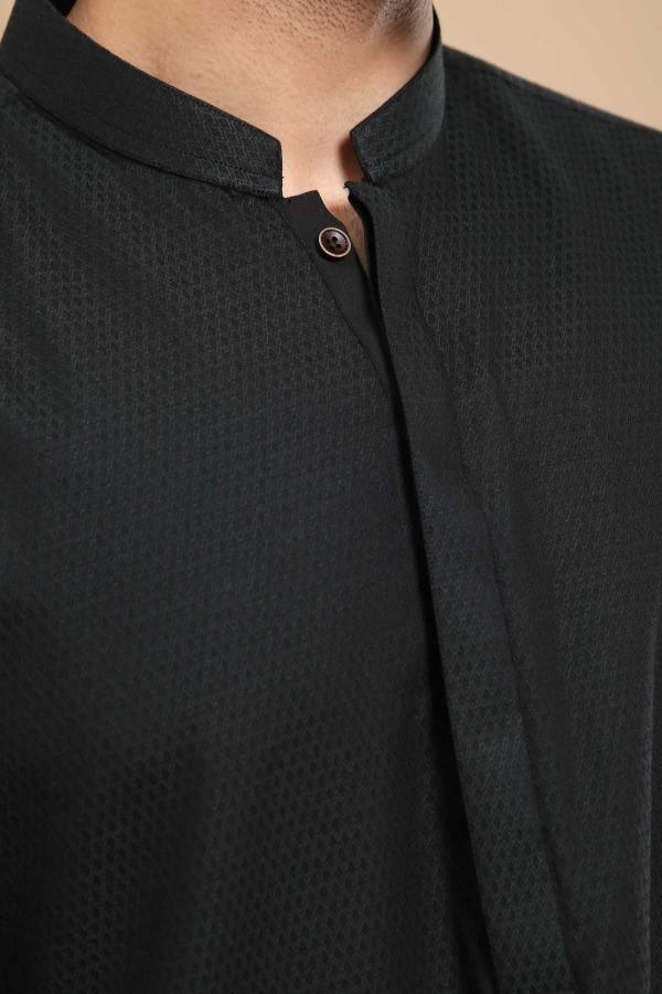 Black band-collar kurta close-up of textured fabric and button placket