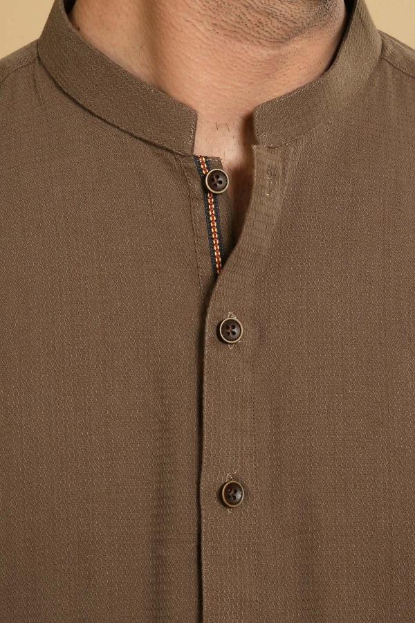 Ban-collar kurta close-up: round buttons and embroidered button placket