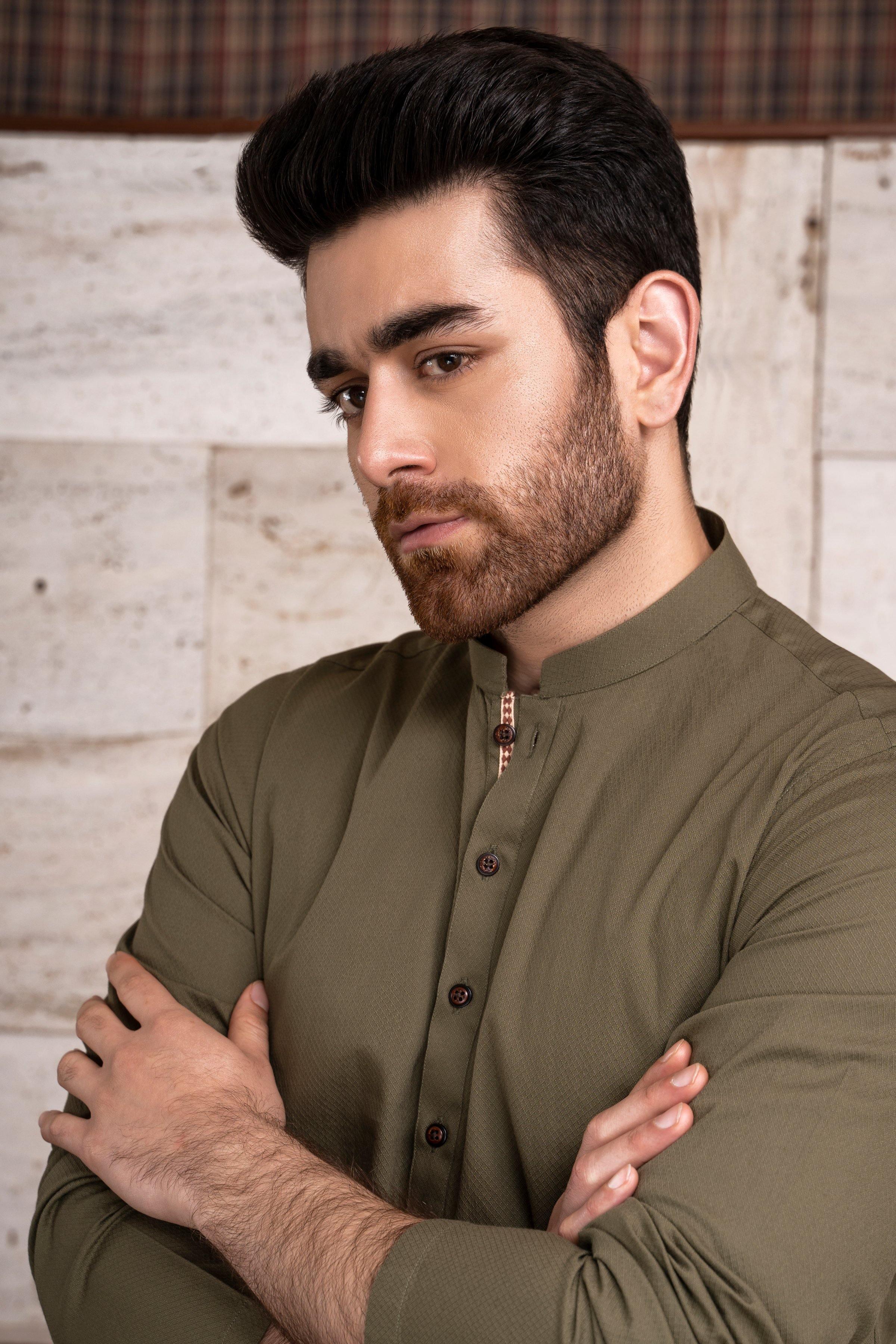 Green kurta band collar with dark buttons; close-up of upper chest and sleeves
