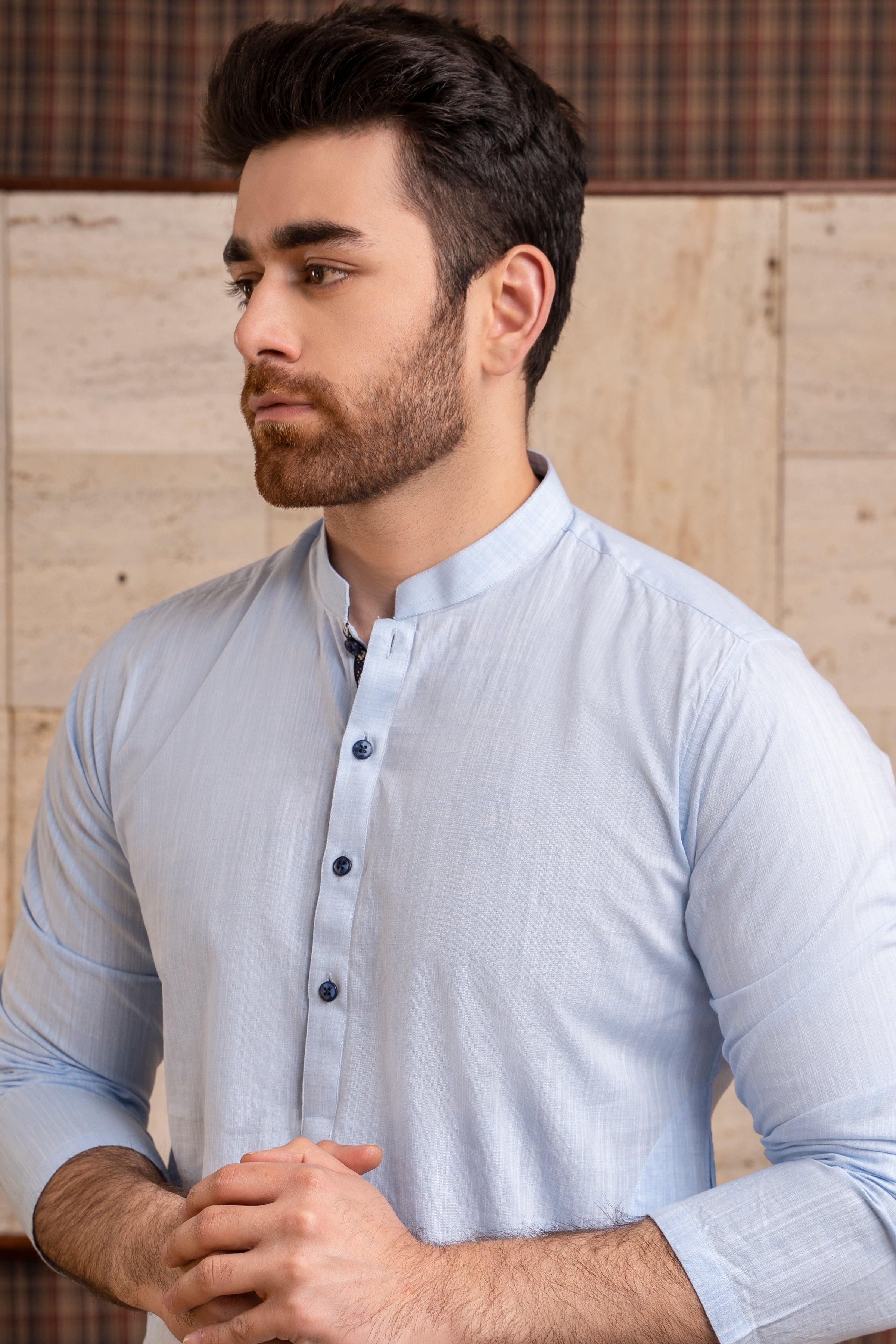 Light sky-blue band-collar kurta close-up, dark buttons on front placket, cuffs