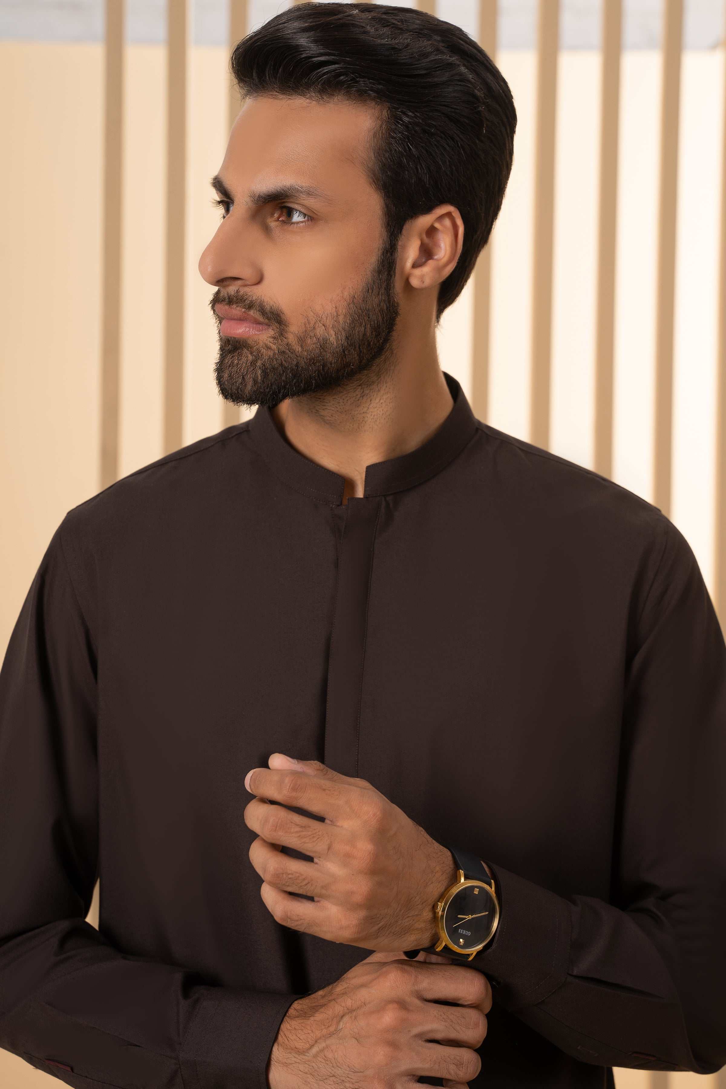 Men's dark kurta close-up with stand collar and center placket