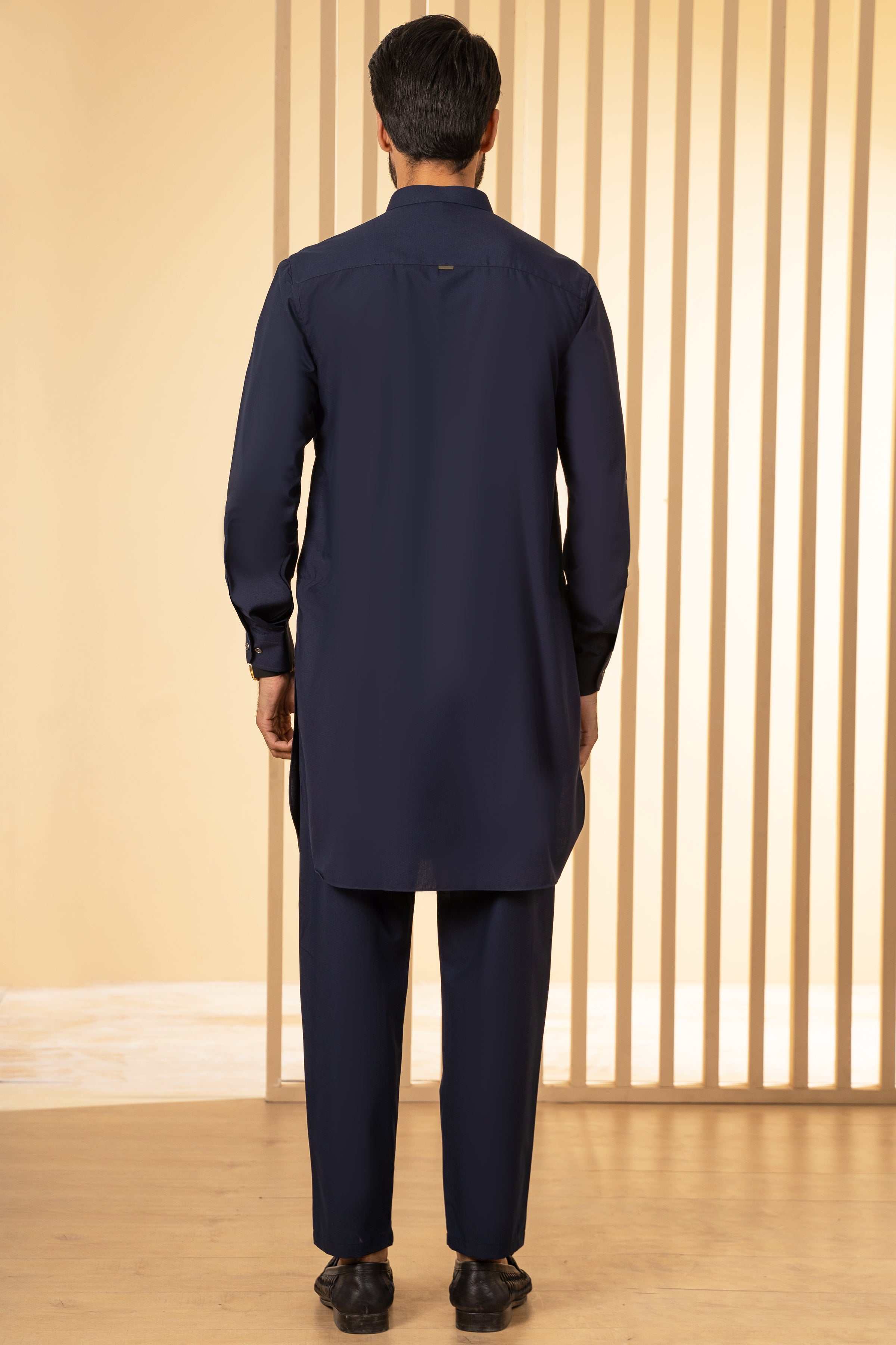 Navy kurta pajama set, back view: long tunic and straight pajama pants