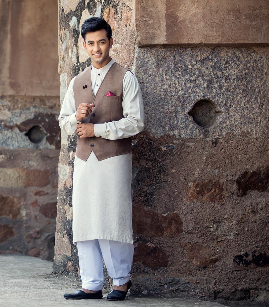 Light cream band-collar kurta with long sleeves and buttoned front, below-knee length