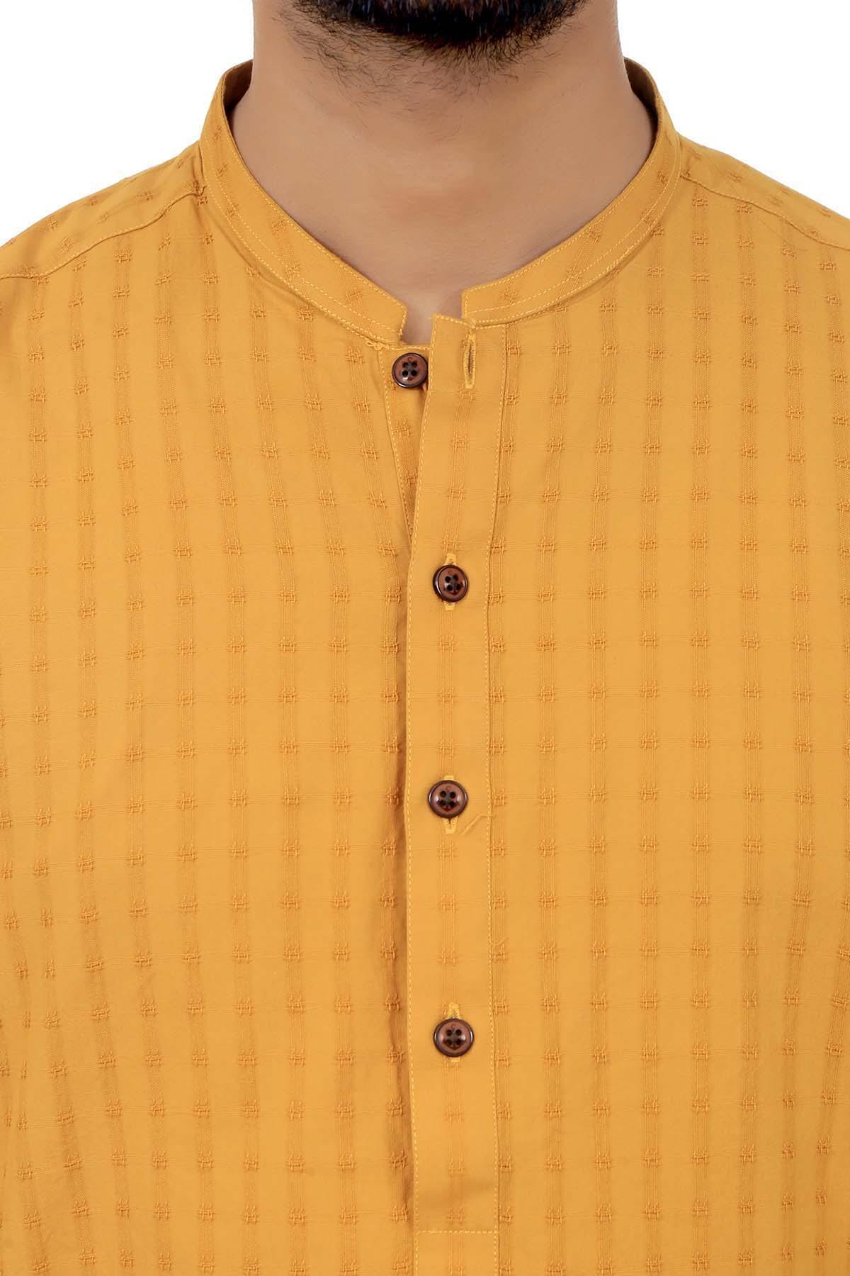 Mustard band-collar kurta close-up with button placket and textured fabric