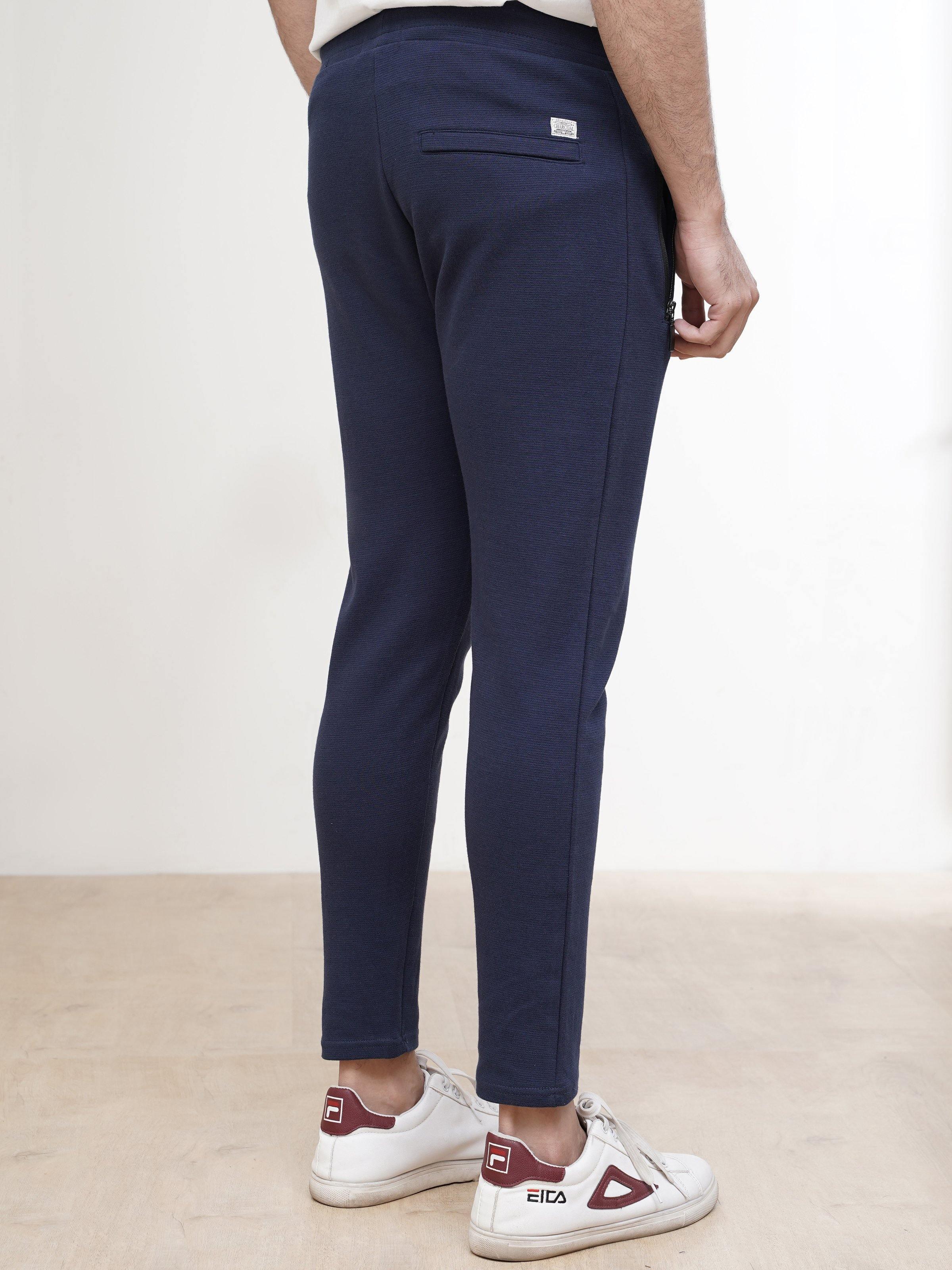 Dark blue jogger trousers with tapered fit and stitched side pocket
