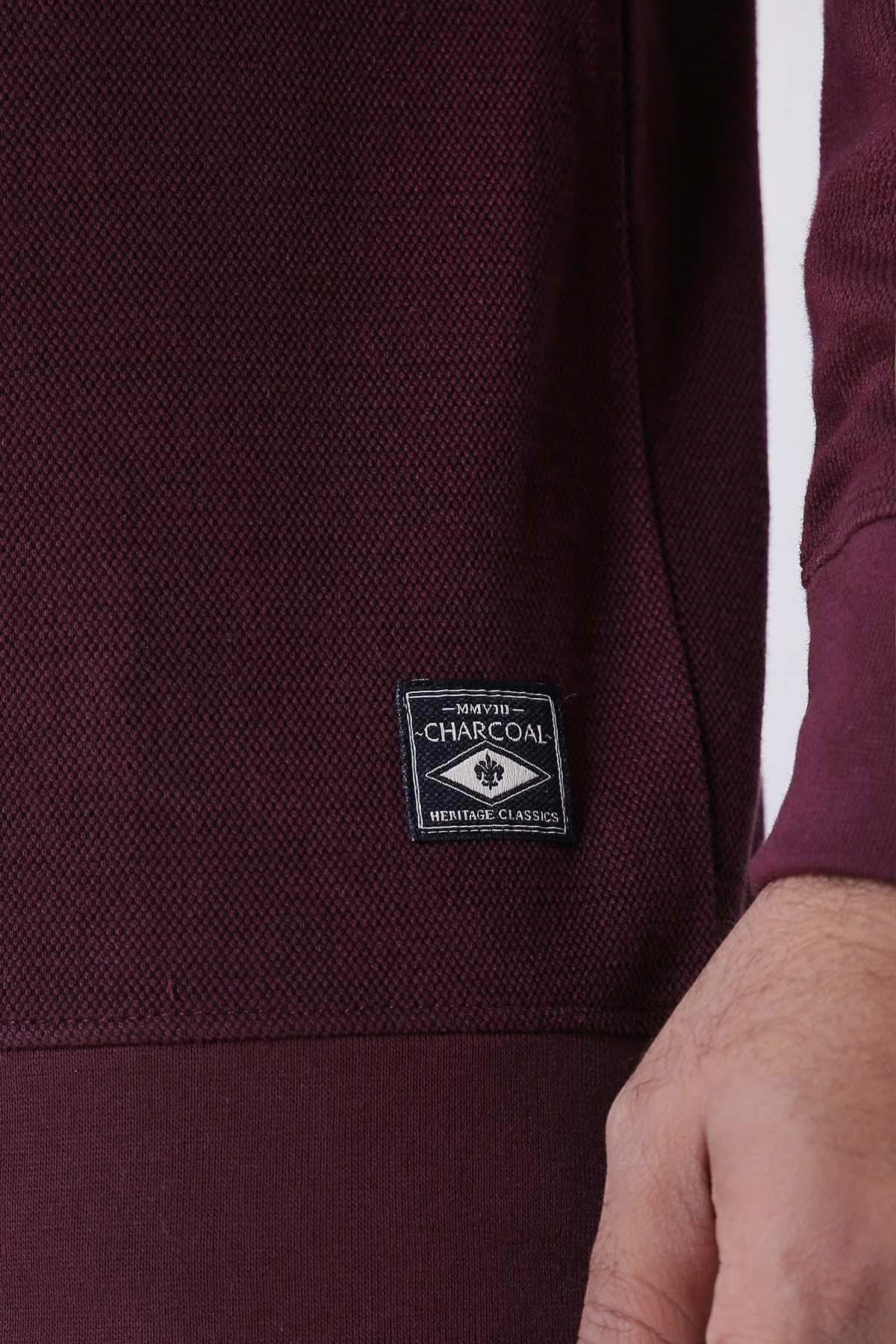 Maroon terry sweatshirt logo patch detail on the chest