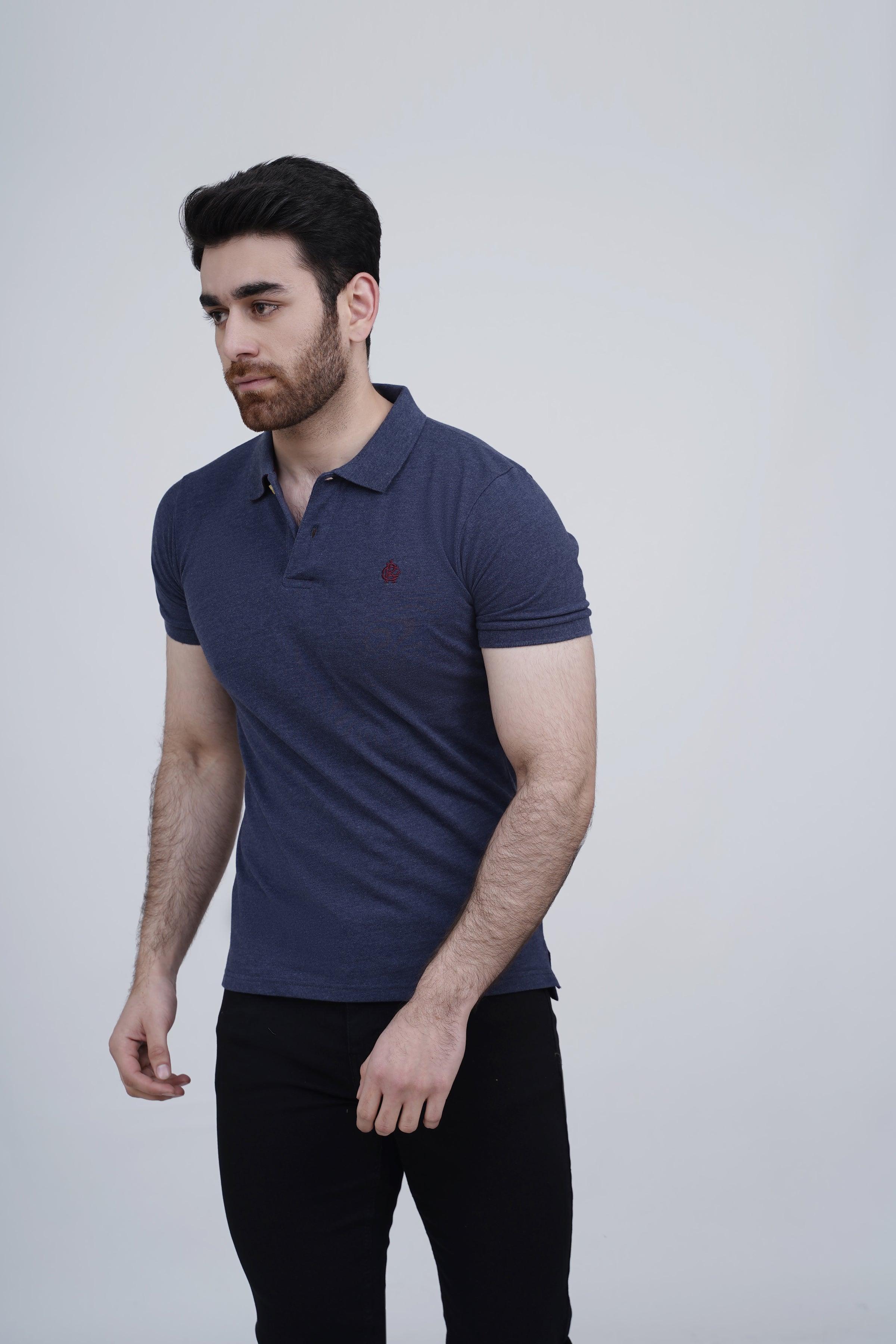 Navy polo shirt on model, short sleeves, collar and button placket, chest logo