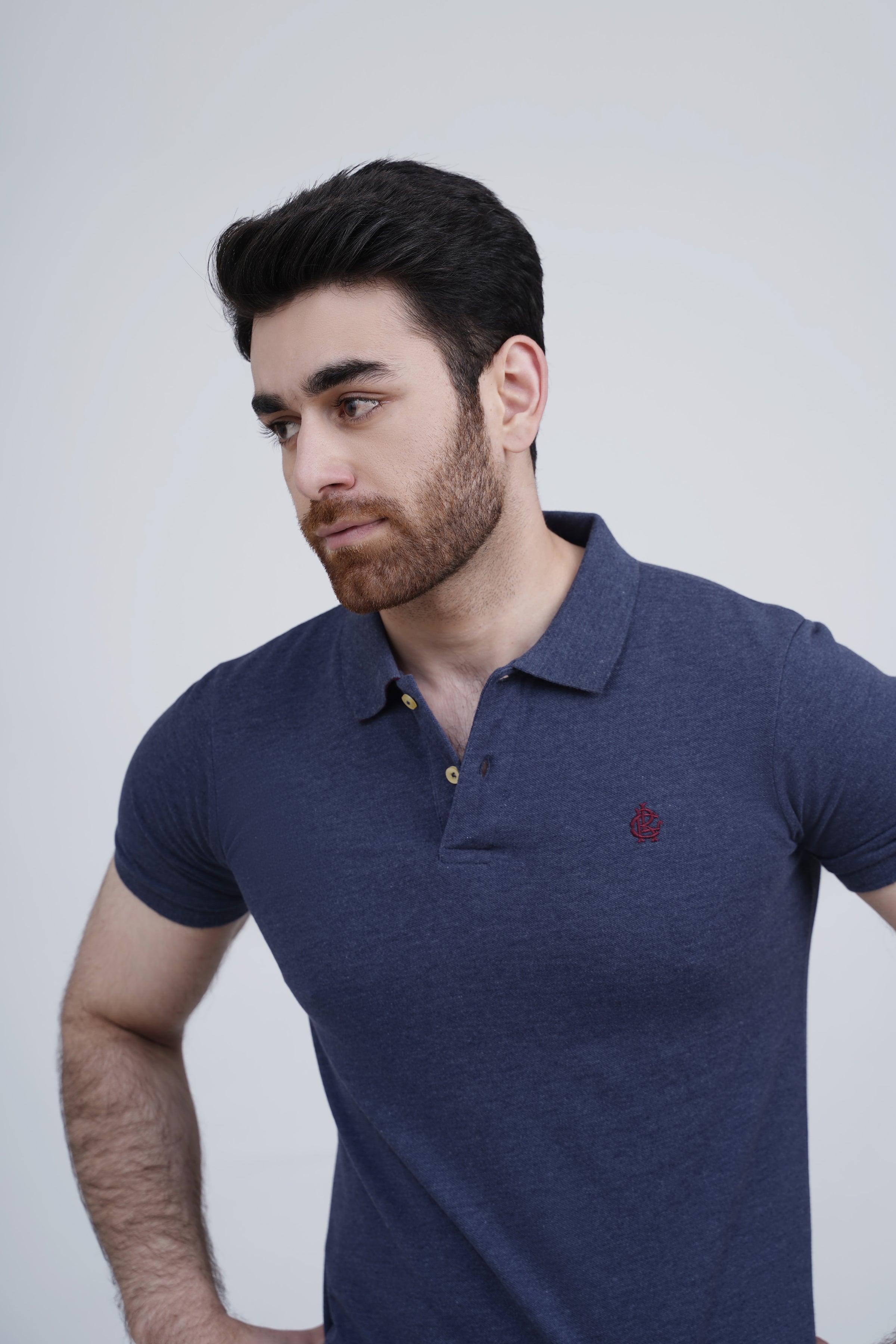 Navy polo shirt close-up with button placket, collar and small chest logo