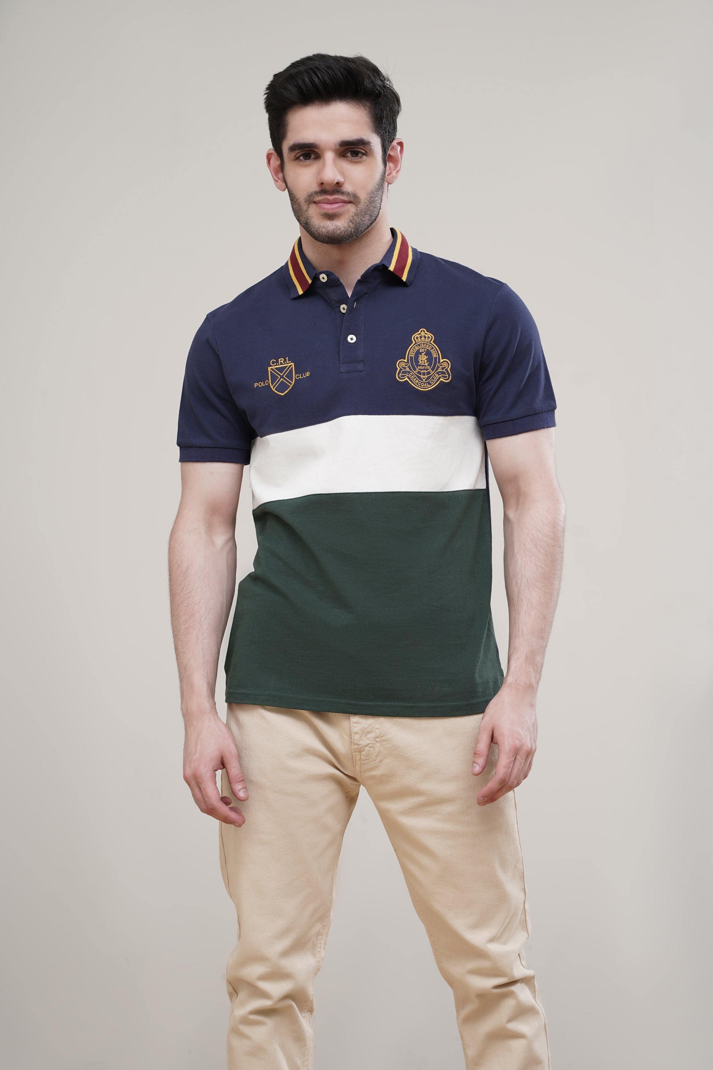 Navy polo shirt with striped collar, crest logo, white and green color block