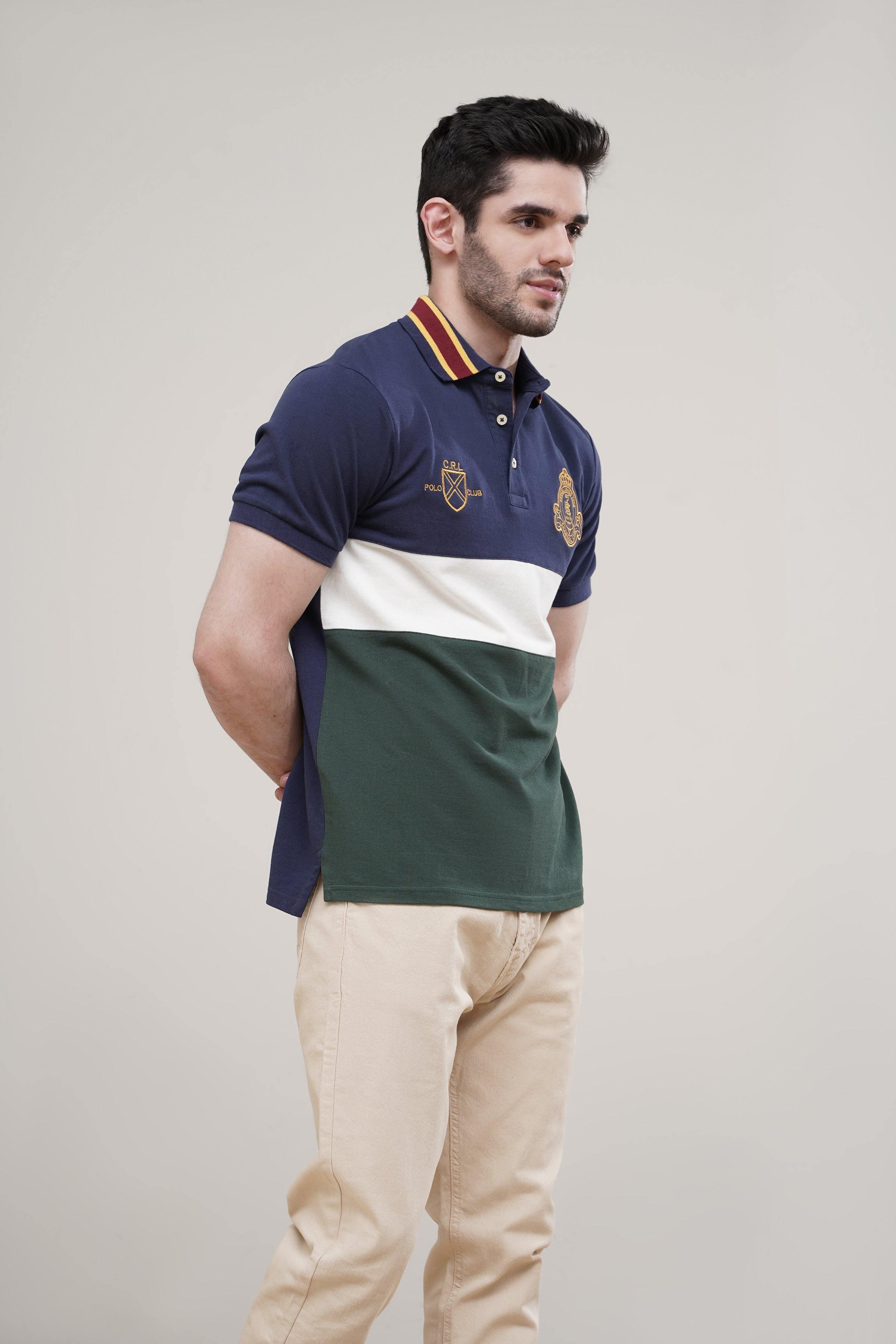 Navy polo shirt, crest logos, short sleeves, white and green color block