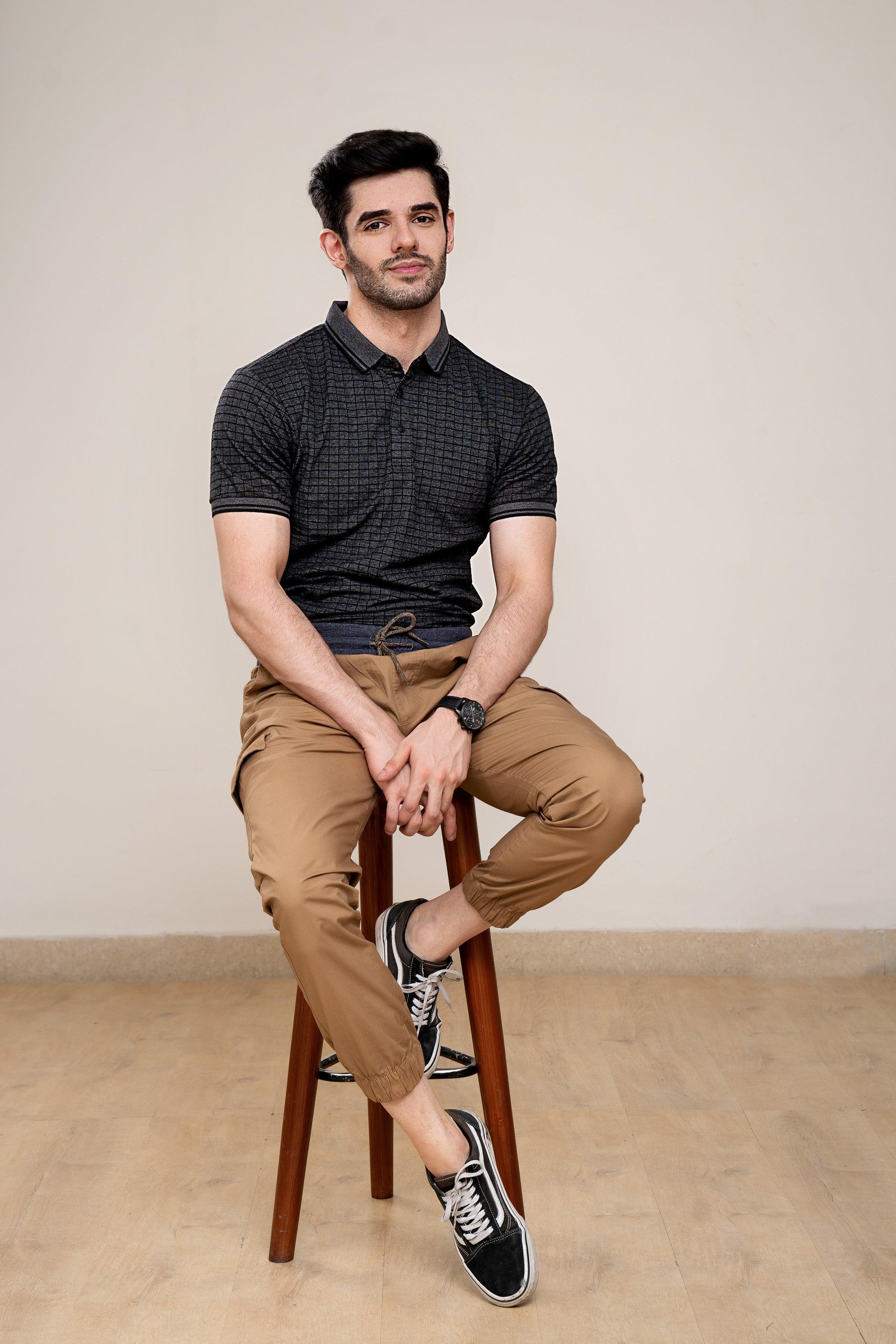 Charcoal grid-pattern polo shirt with ribbed collar, worn with khaki pants