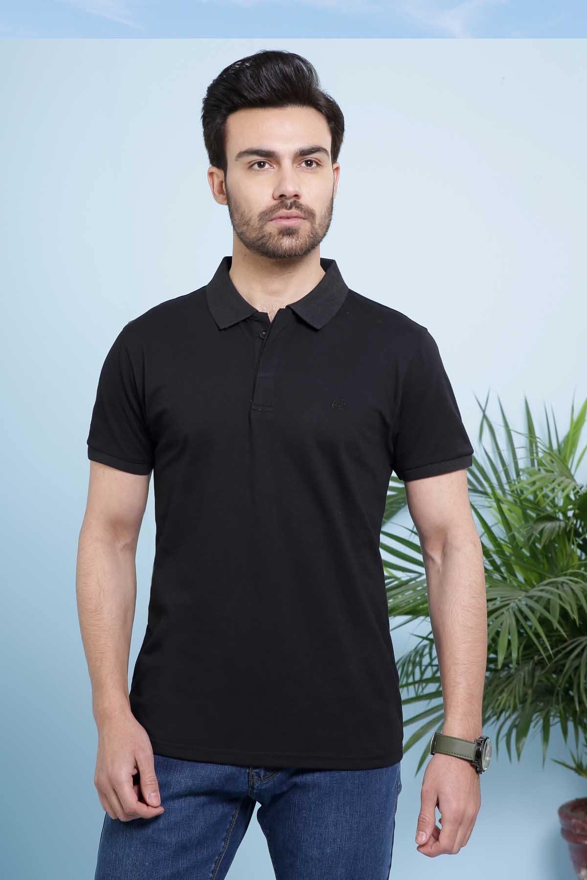 Black polo shirt with knit collar and short sleeves, worn with blue jeans