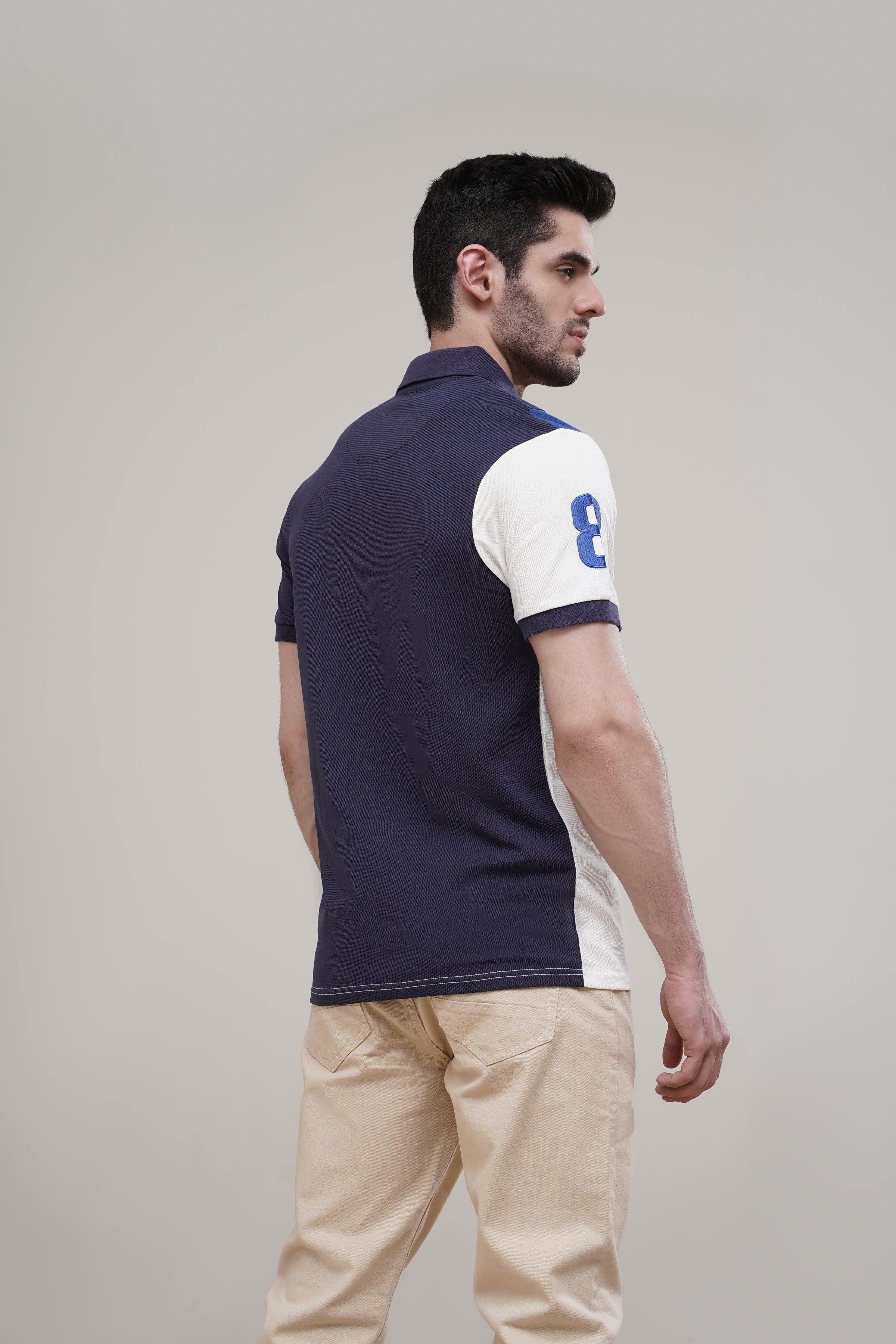 Navy polo shirt back with white sleeve panel, small blue graphic, number 8