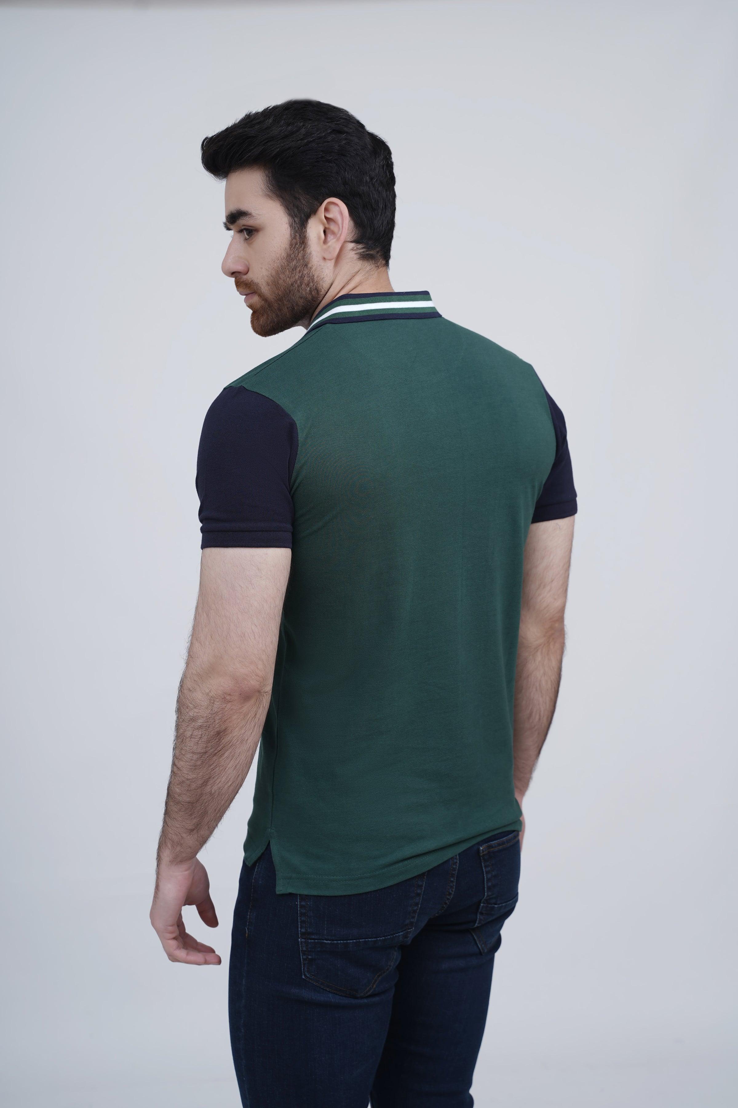 Green polo shirt with navy sleeve panels and striped collar trim, plain back