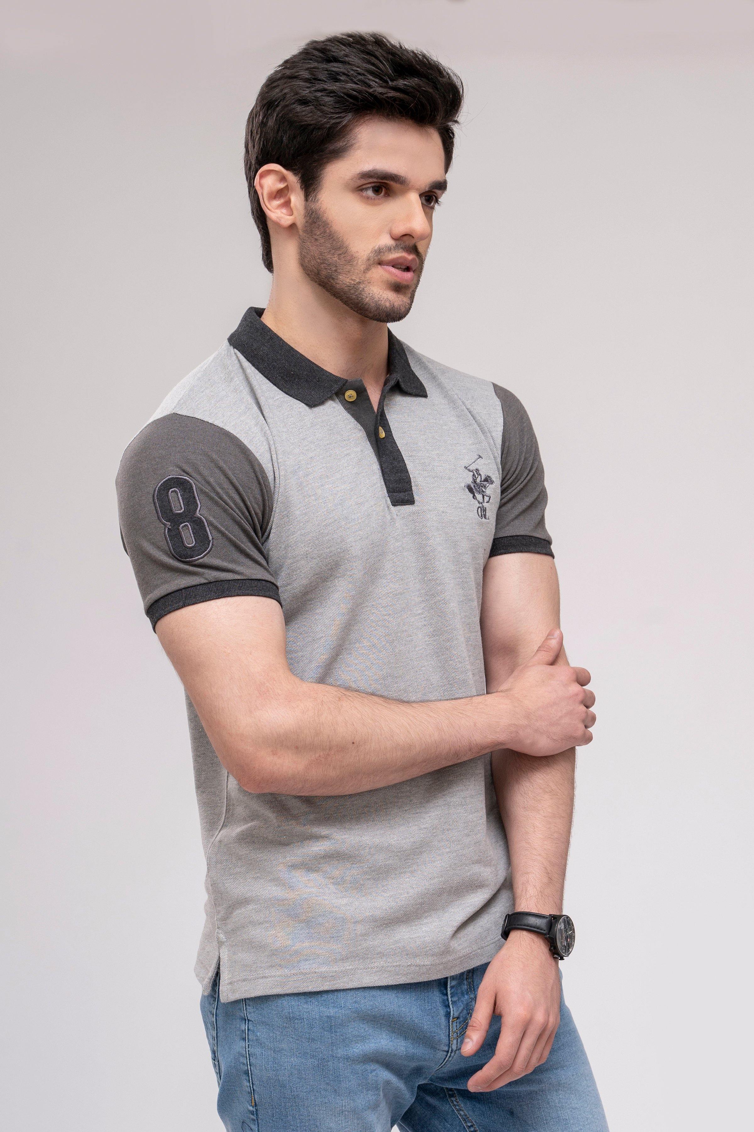 Grey polo shirt with dark sleeve trim and small chest logo