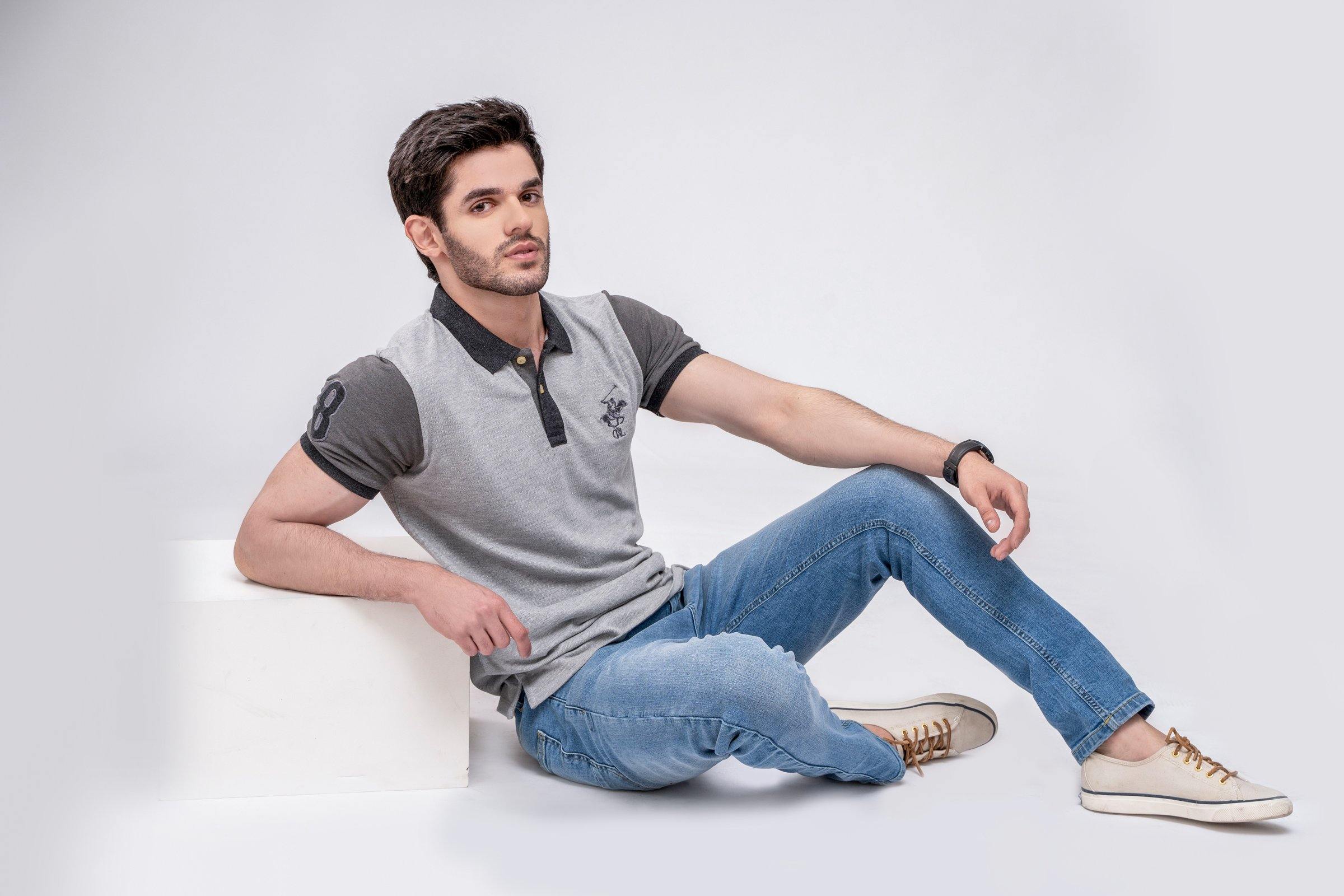 Grey polo shirt with dark collar and button placket